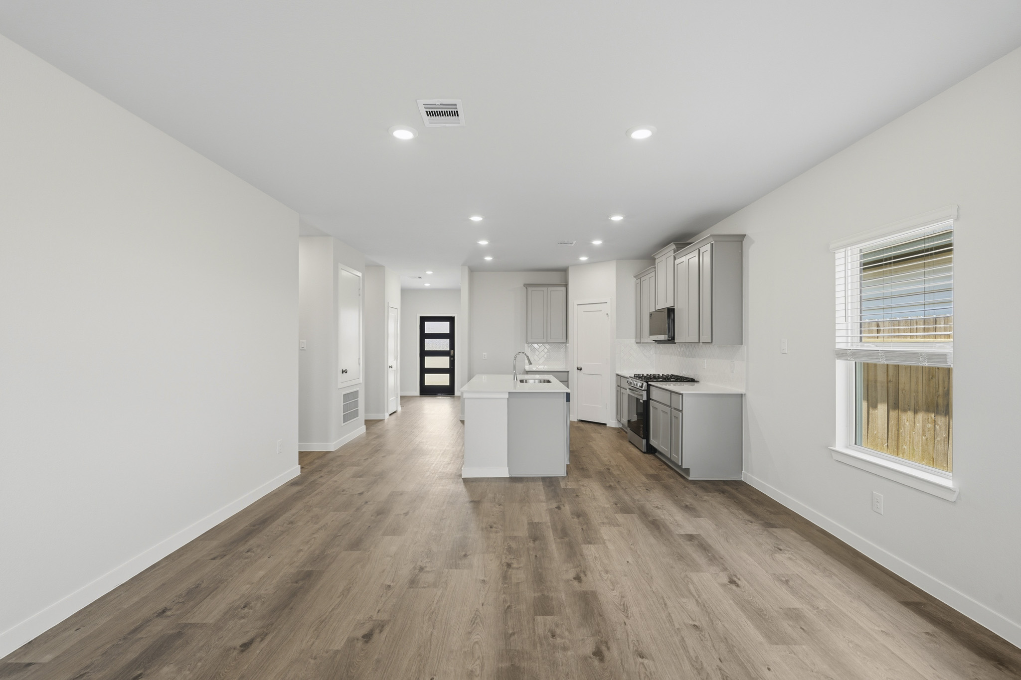 A kitchen with white walls.