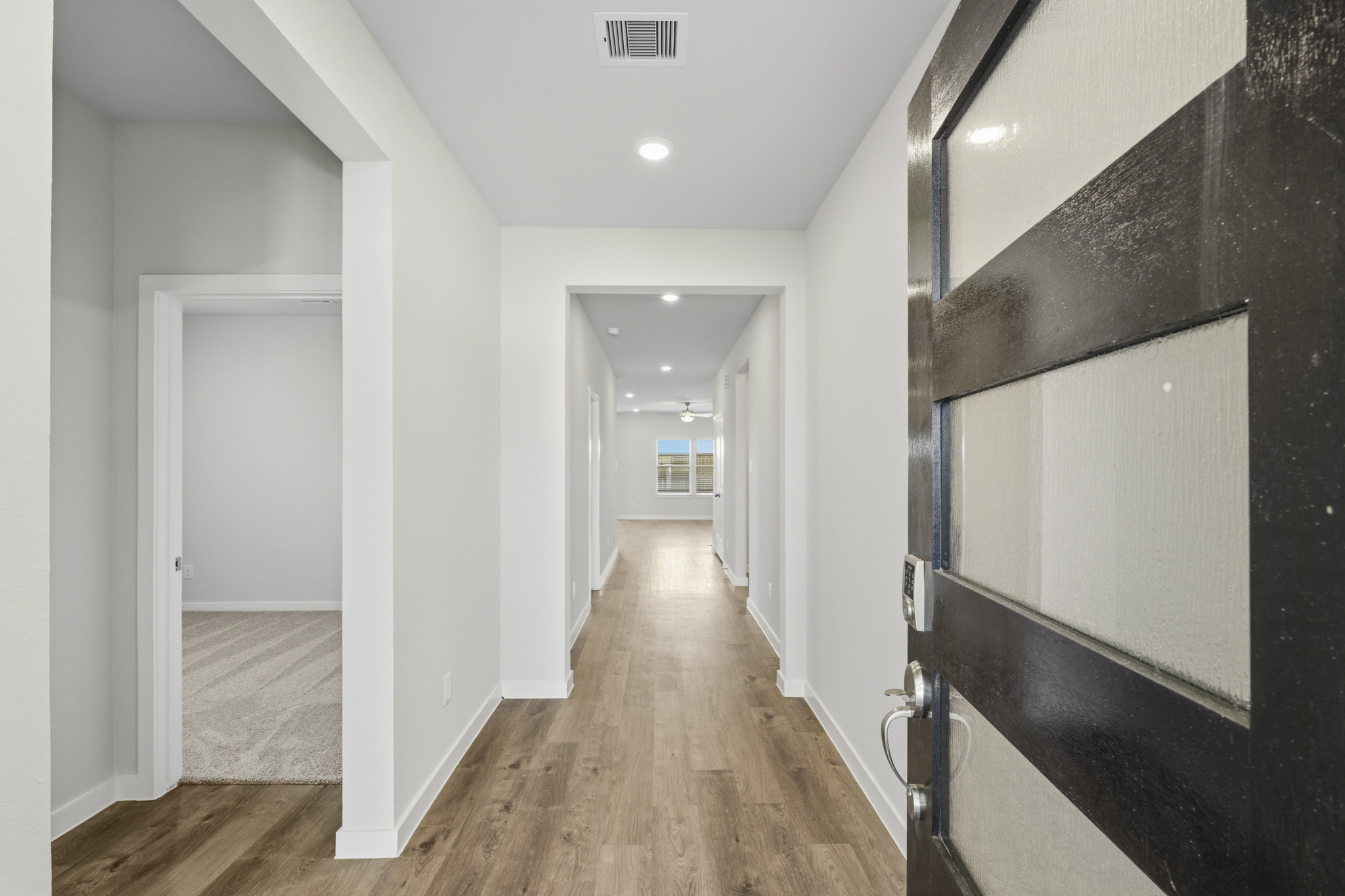 A hallway with black walls.