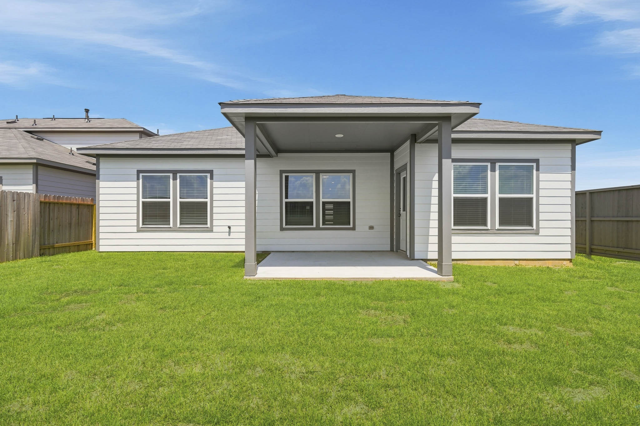 A house with a grass yard.