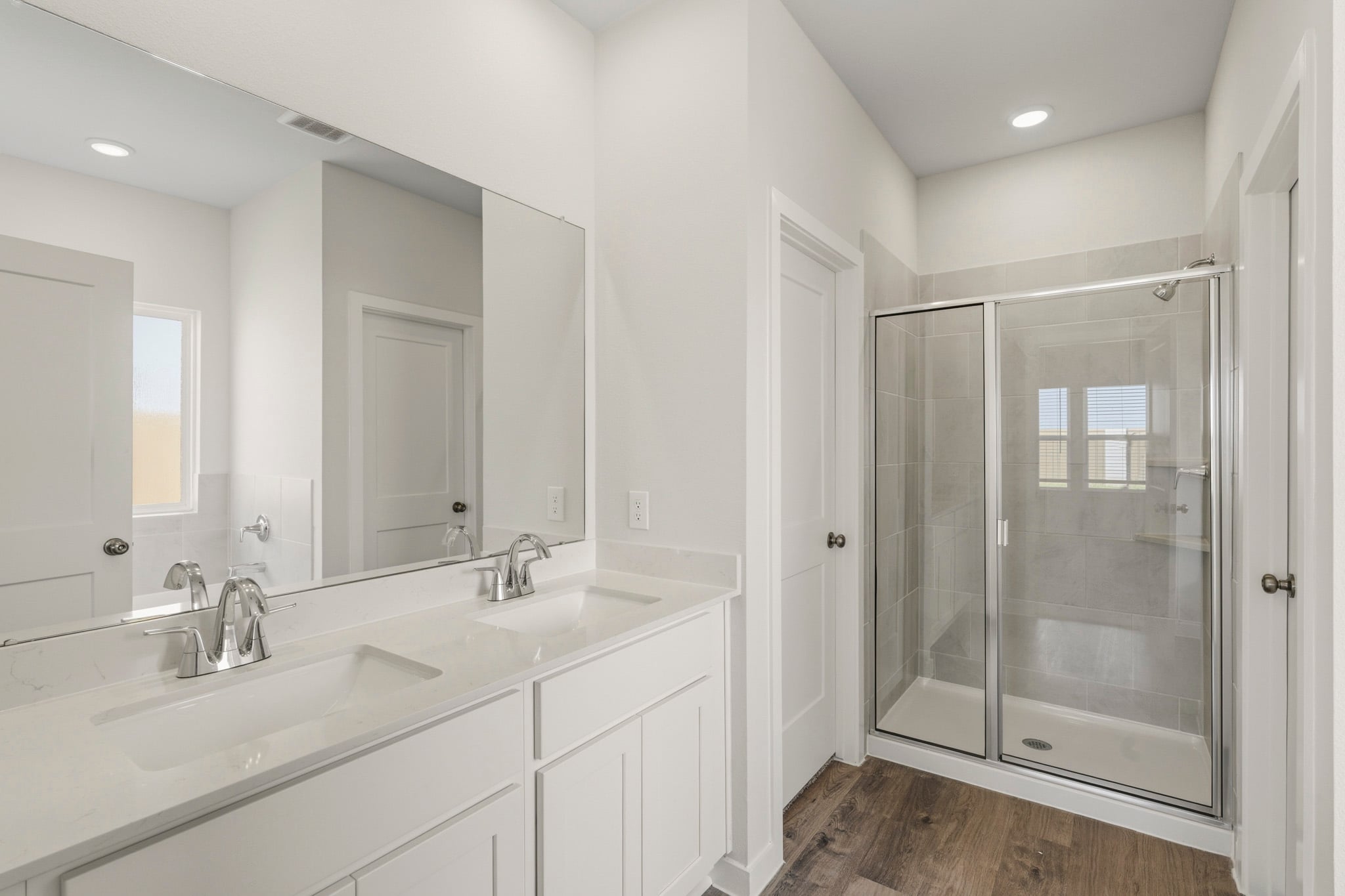 A bathroom with a glass shower.