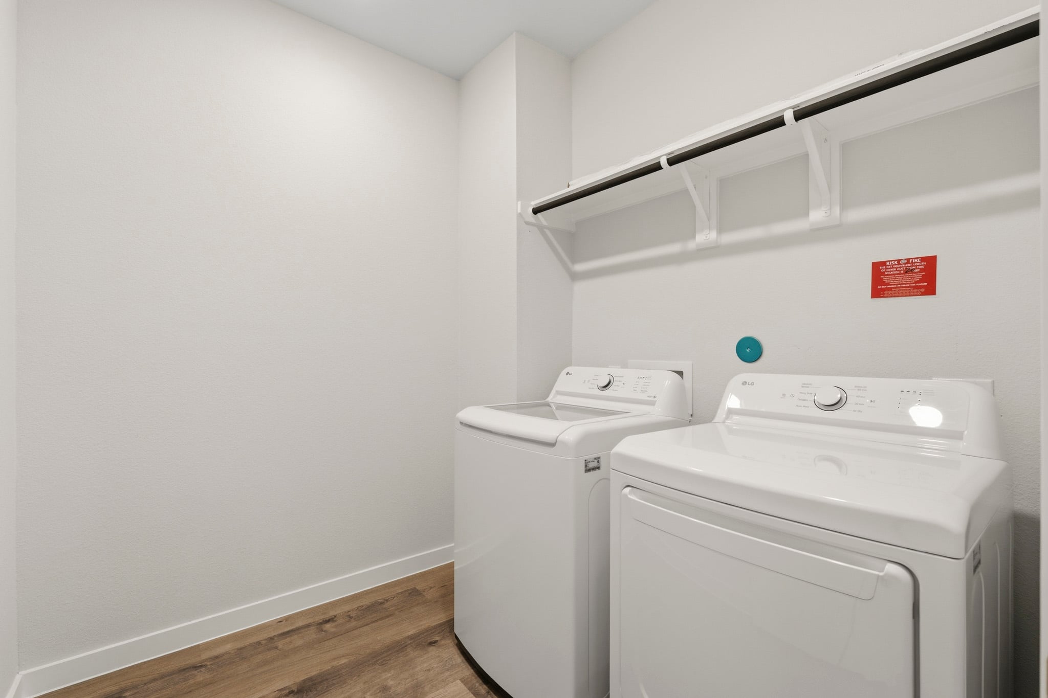 A laundry room with a washer and dryer.