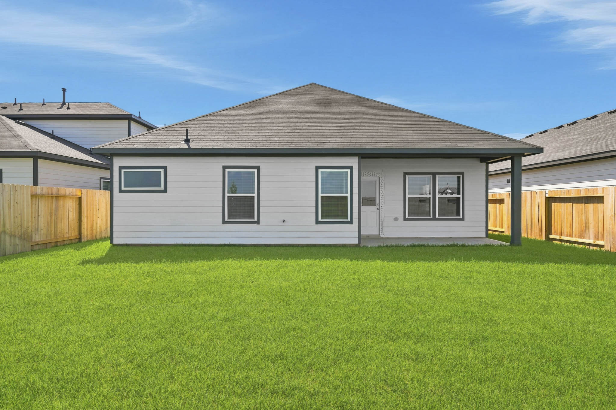 A house with a grass yard.