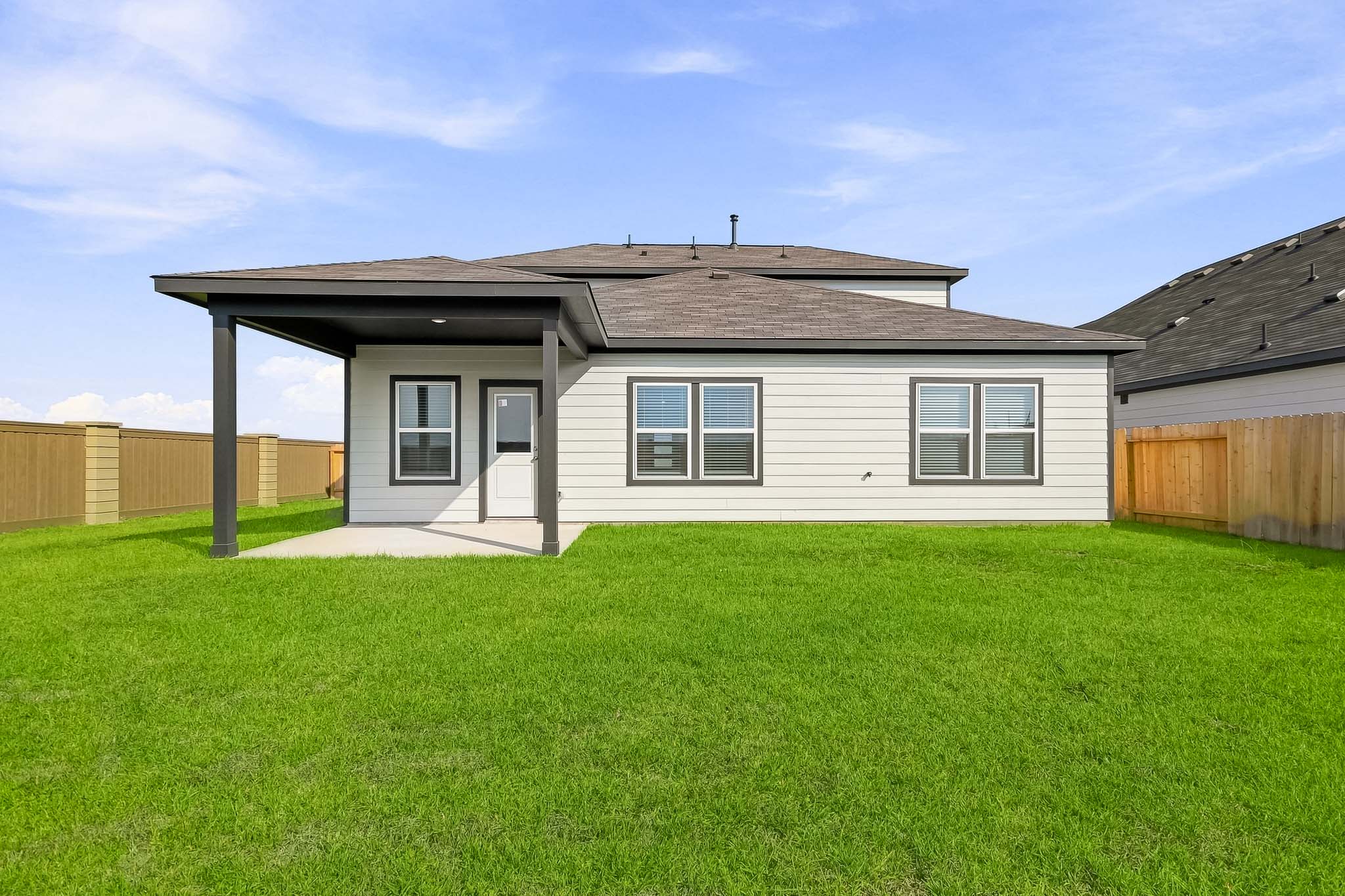 A house with a grass yard.