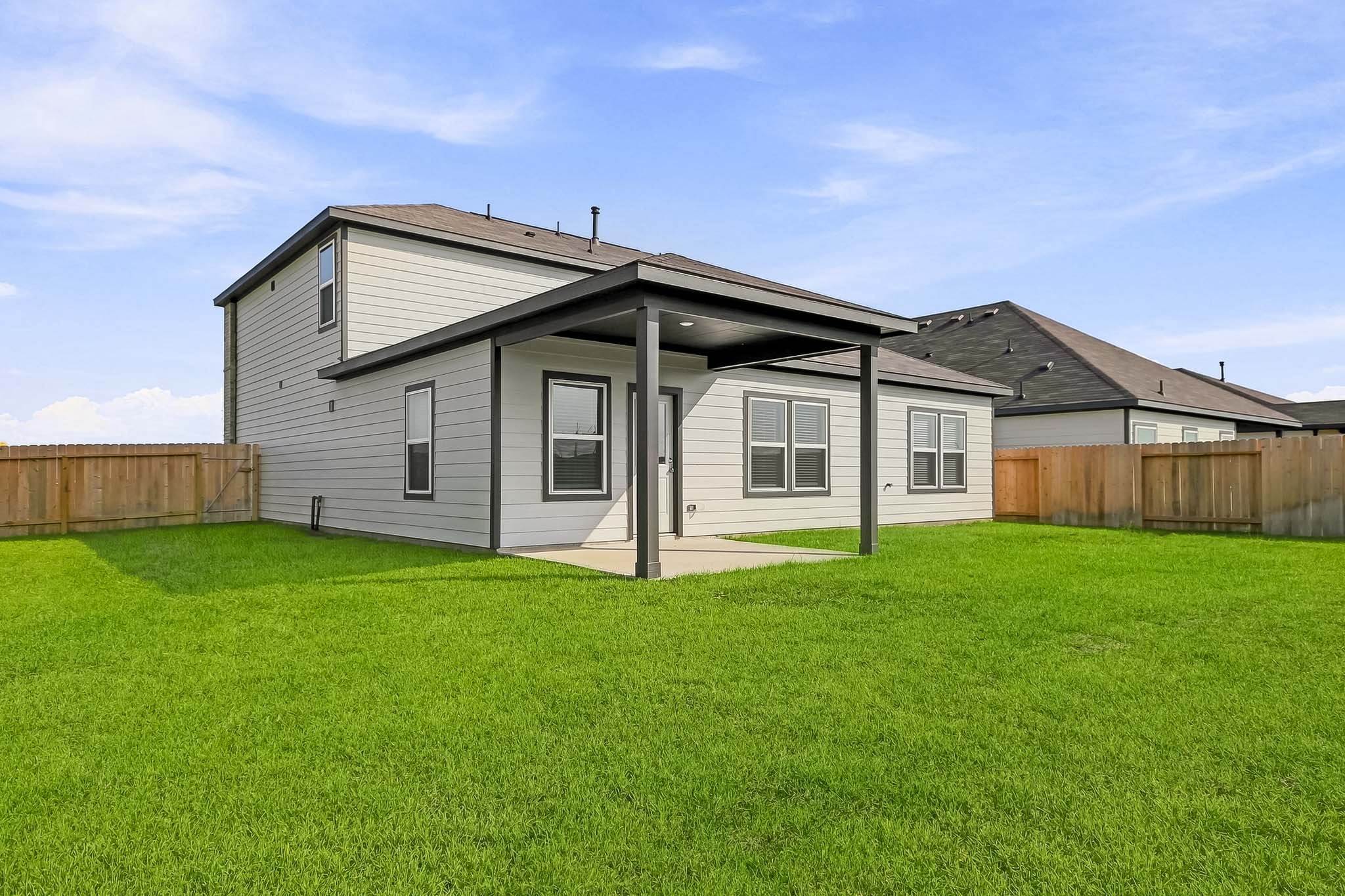 A house with a grass yard.