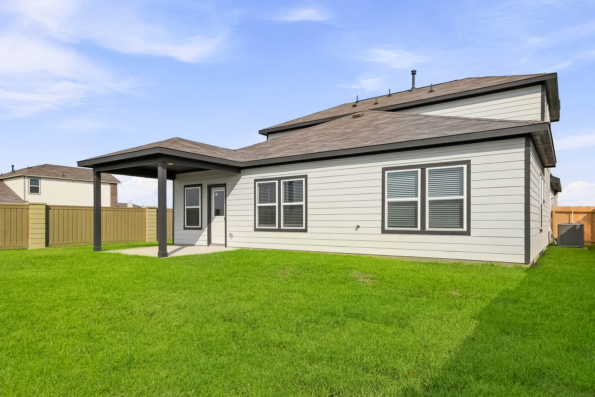 A house with a grass yard.