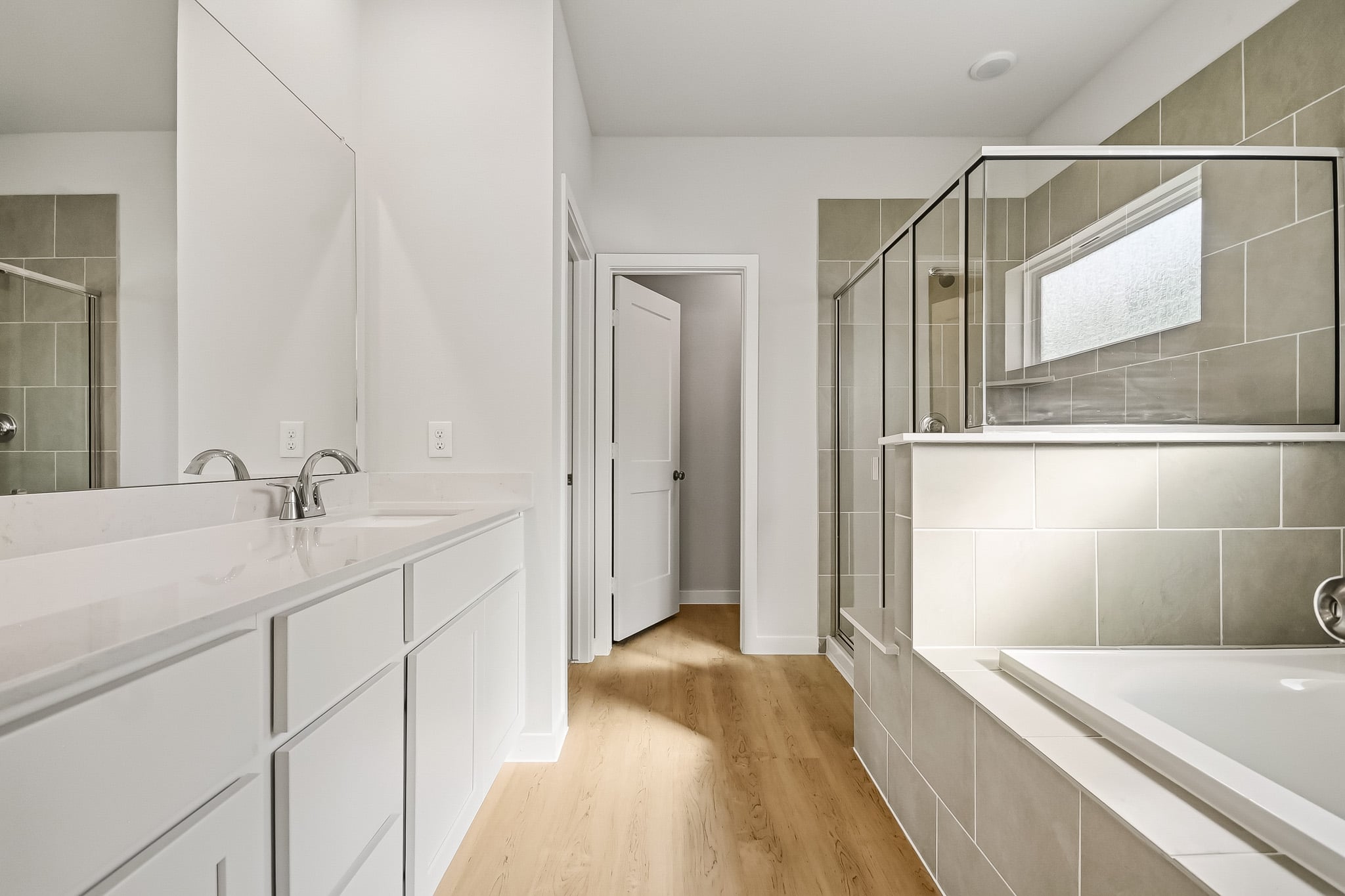 A bathroom with a glass shower.