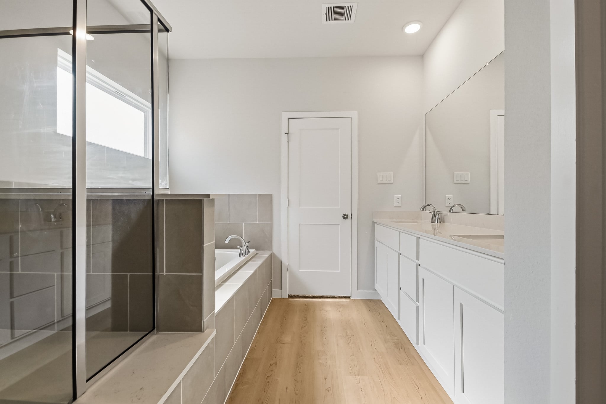 A bathroom with a glass shower.