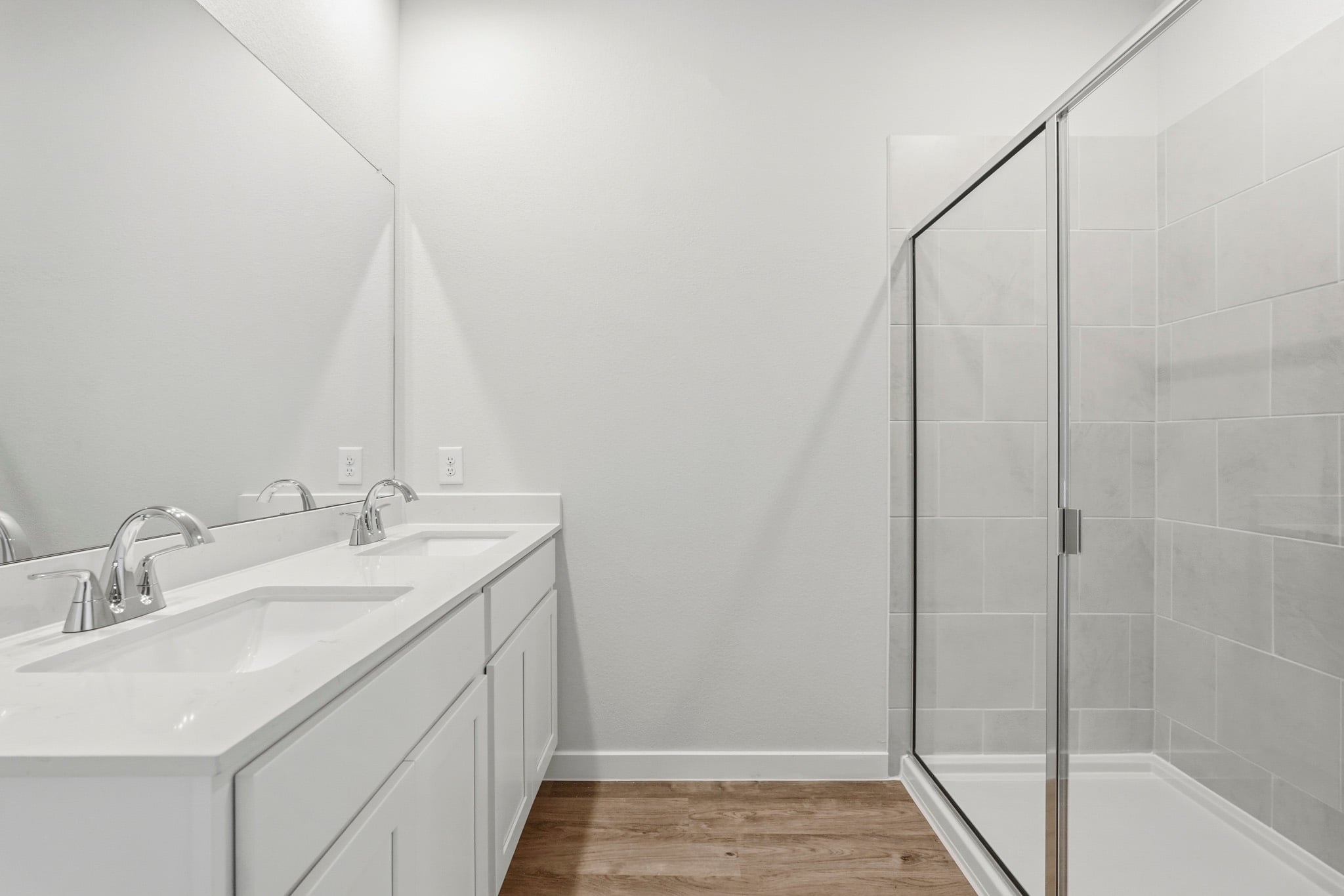 A bathroom with a glass shower.