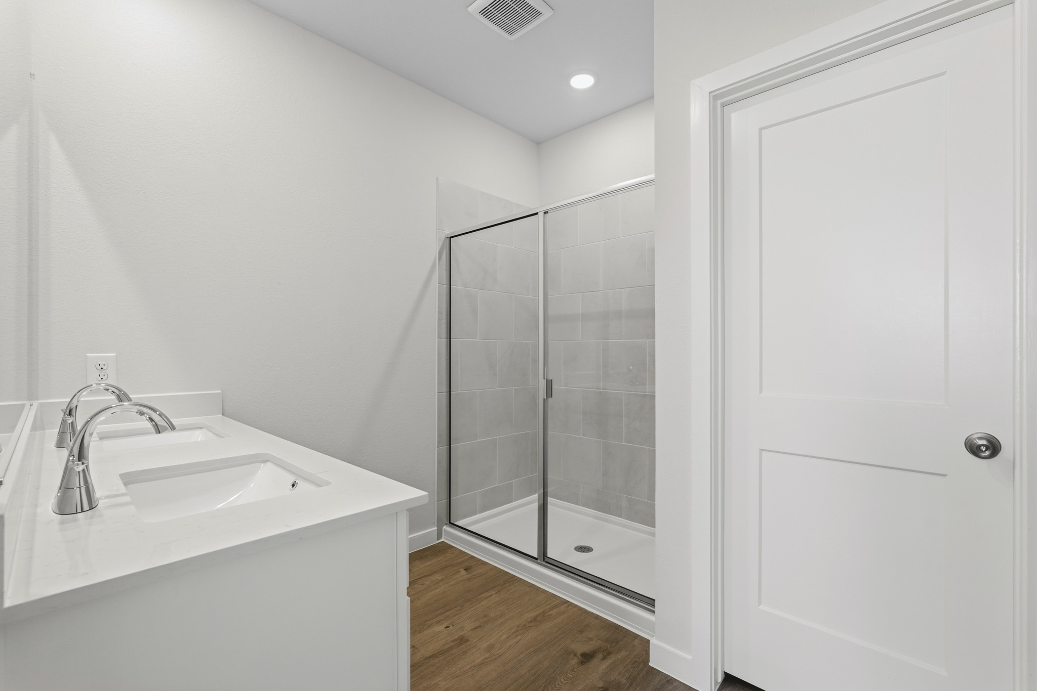 A bathroom with a glass shower.
