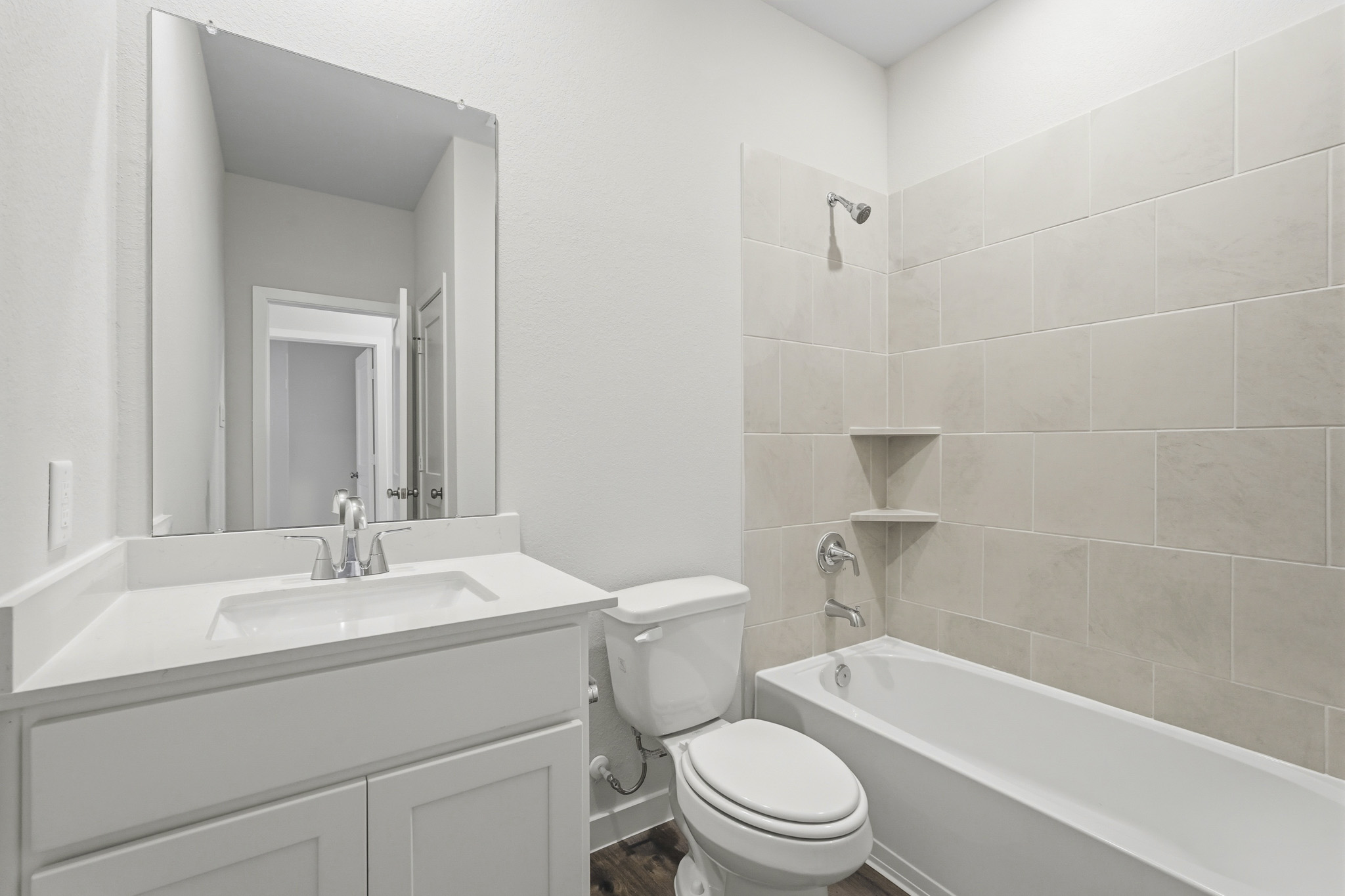 A bathroom with a toilet and sink.