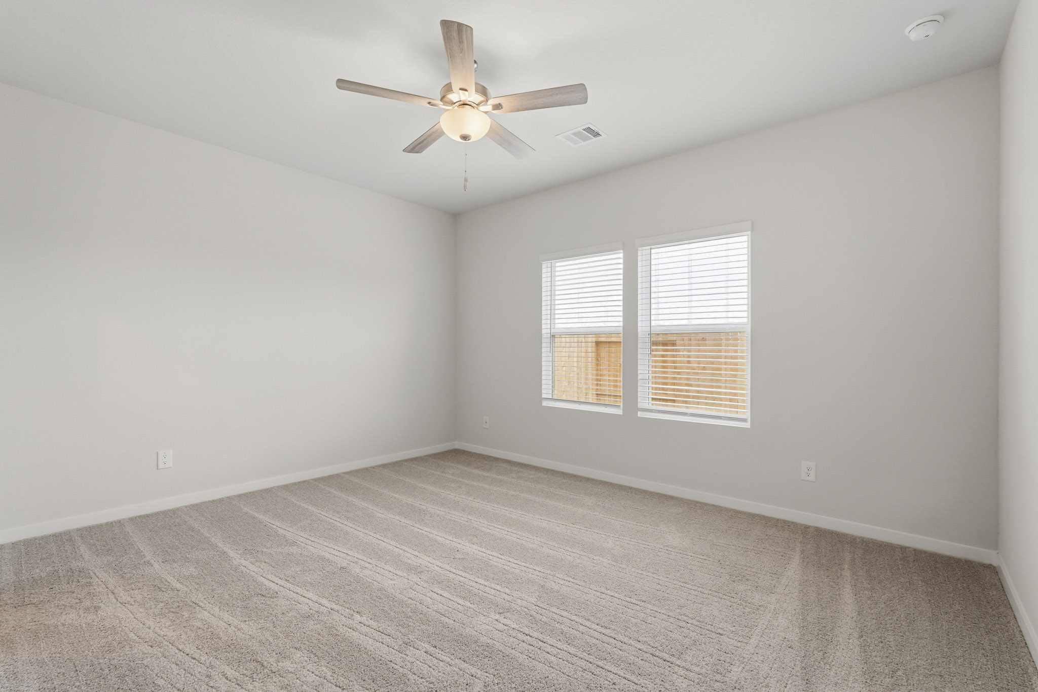 A ceiling fan in a room.