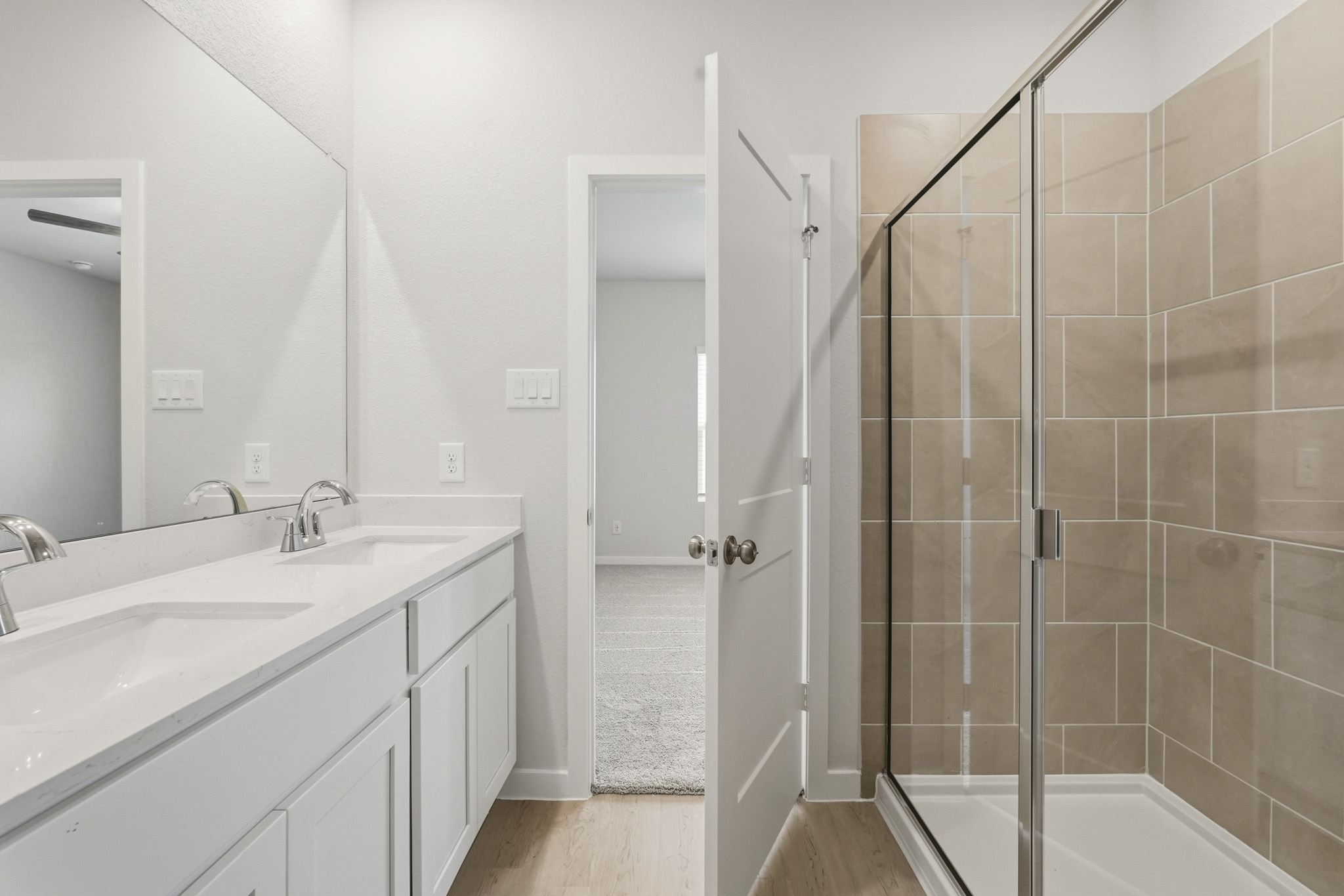 A bathroom with a glass shower.