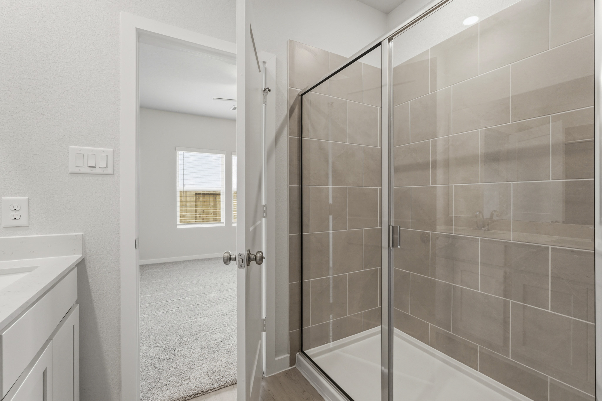 A bathroom with a glass shower.