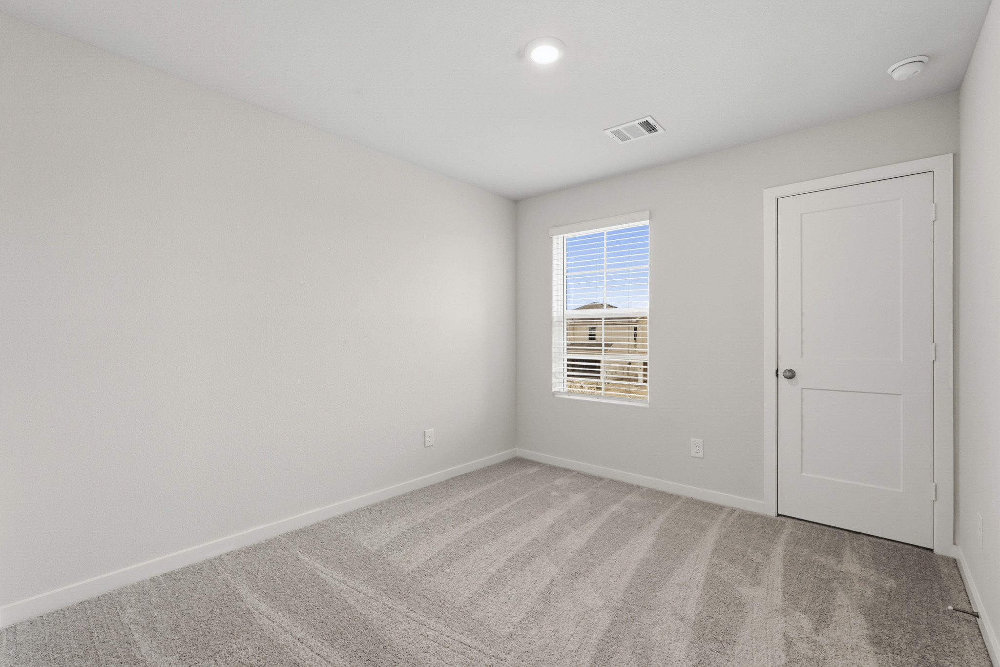 A room with a door and a window.