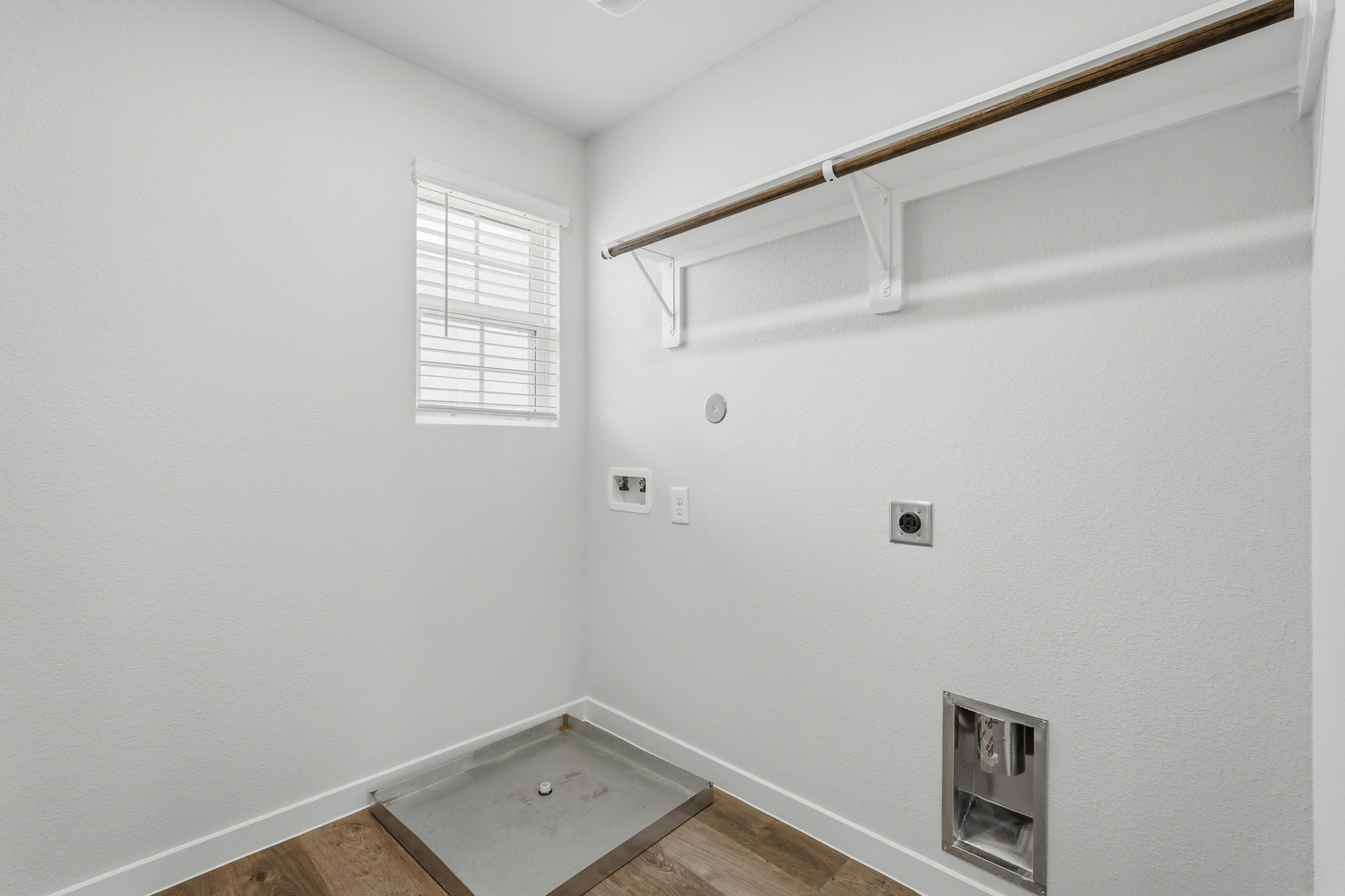 A room with a vent and a window.