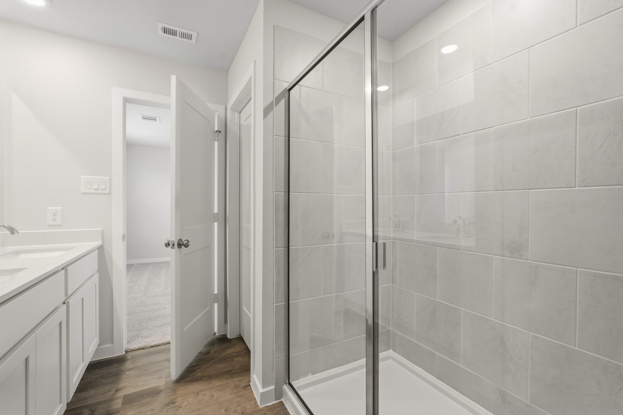 A bathroom with a glass shower.