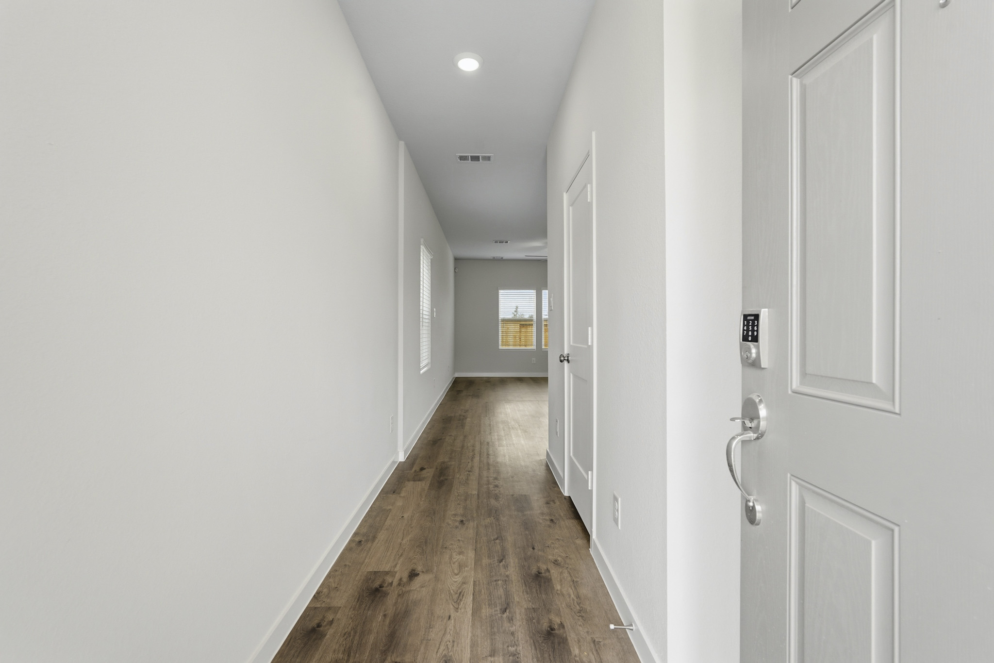 A hallway with white doors.
