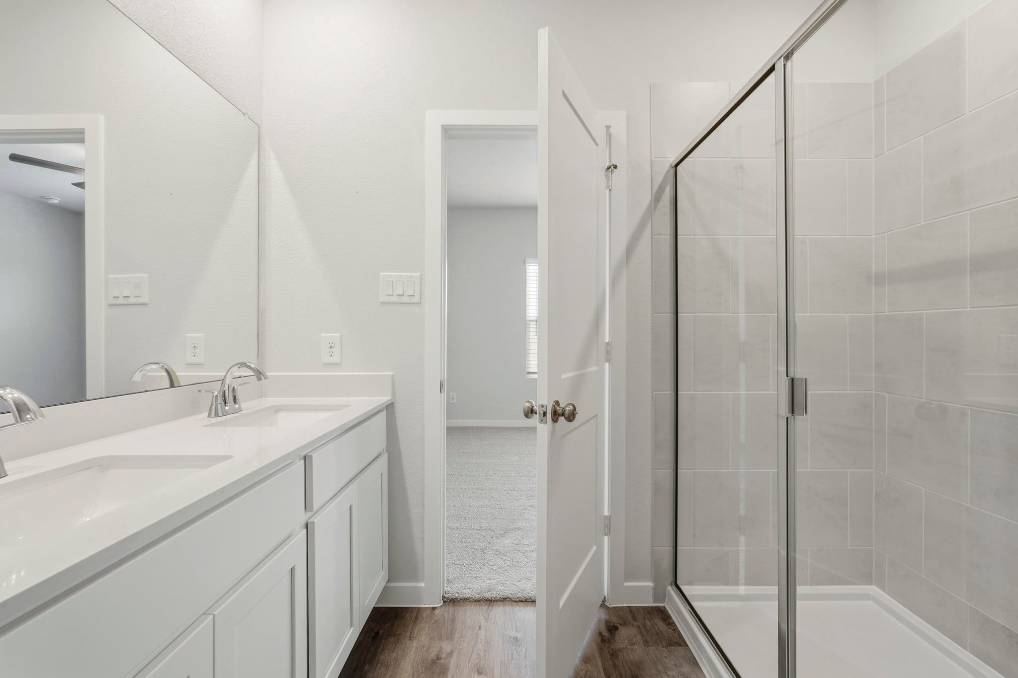 A bathroom with a glass shower.