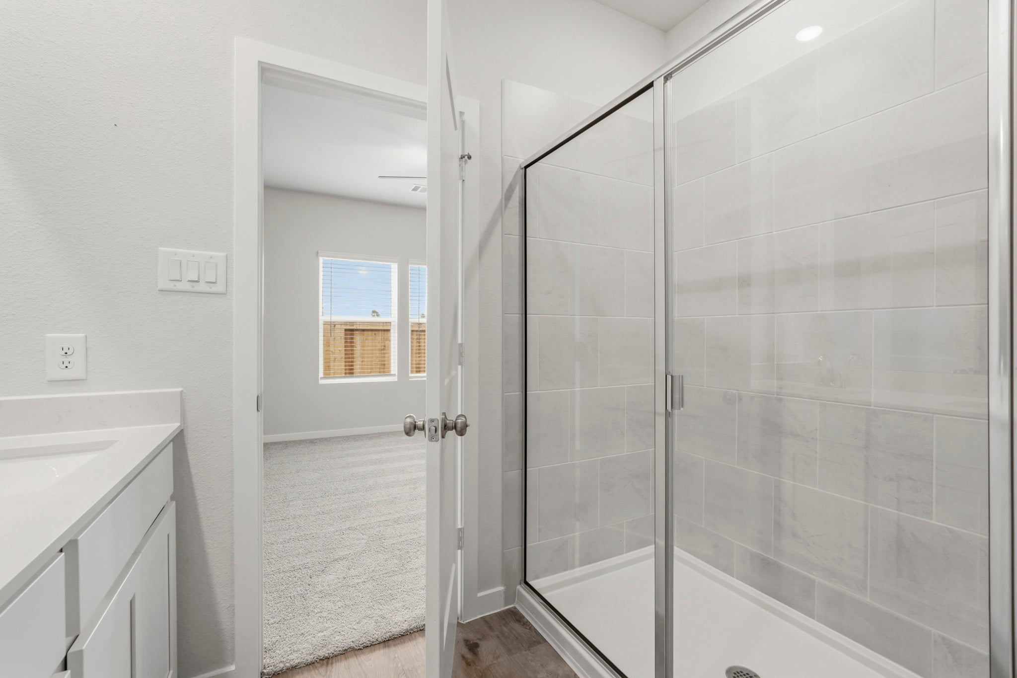 A bathroom with a glass shower.