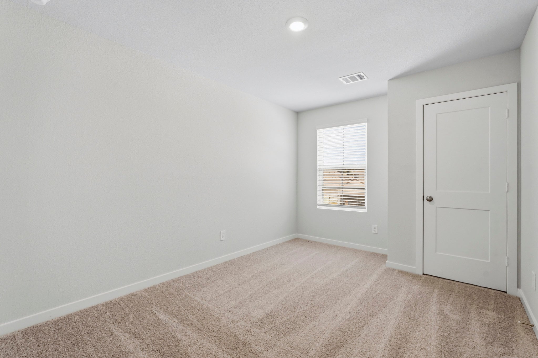 A room with a door and a window.