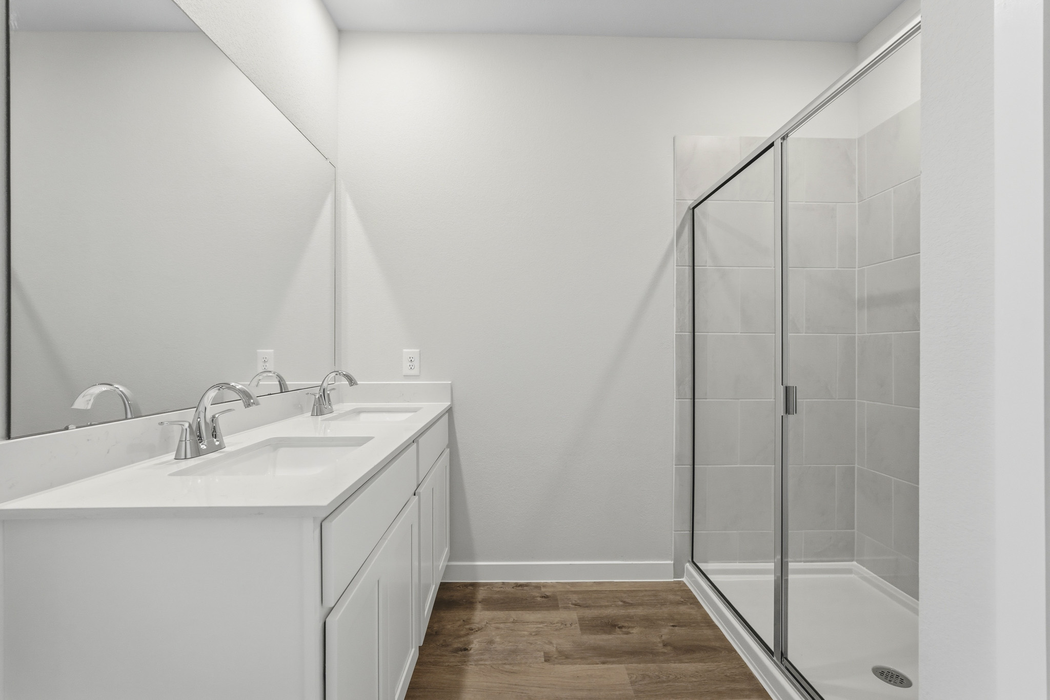 A bathroom with a glass shower.
