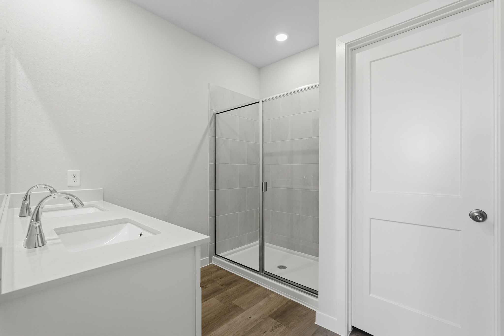 A bathroom with a glass shower.