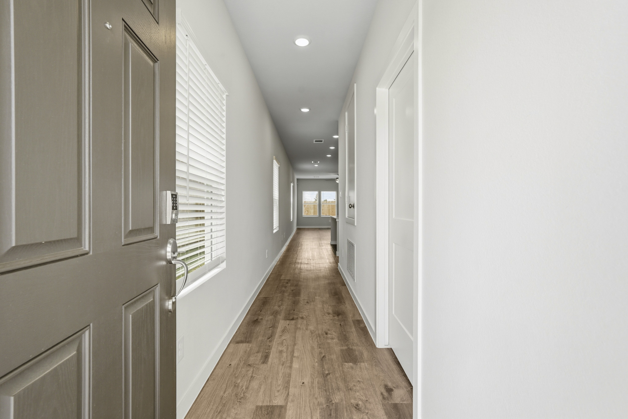 A hallway with white walls.