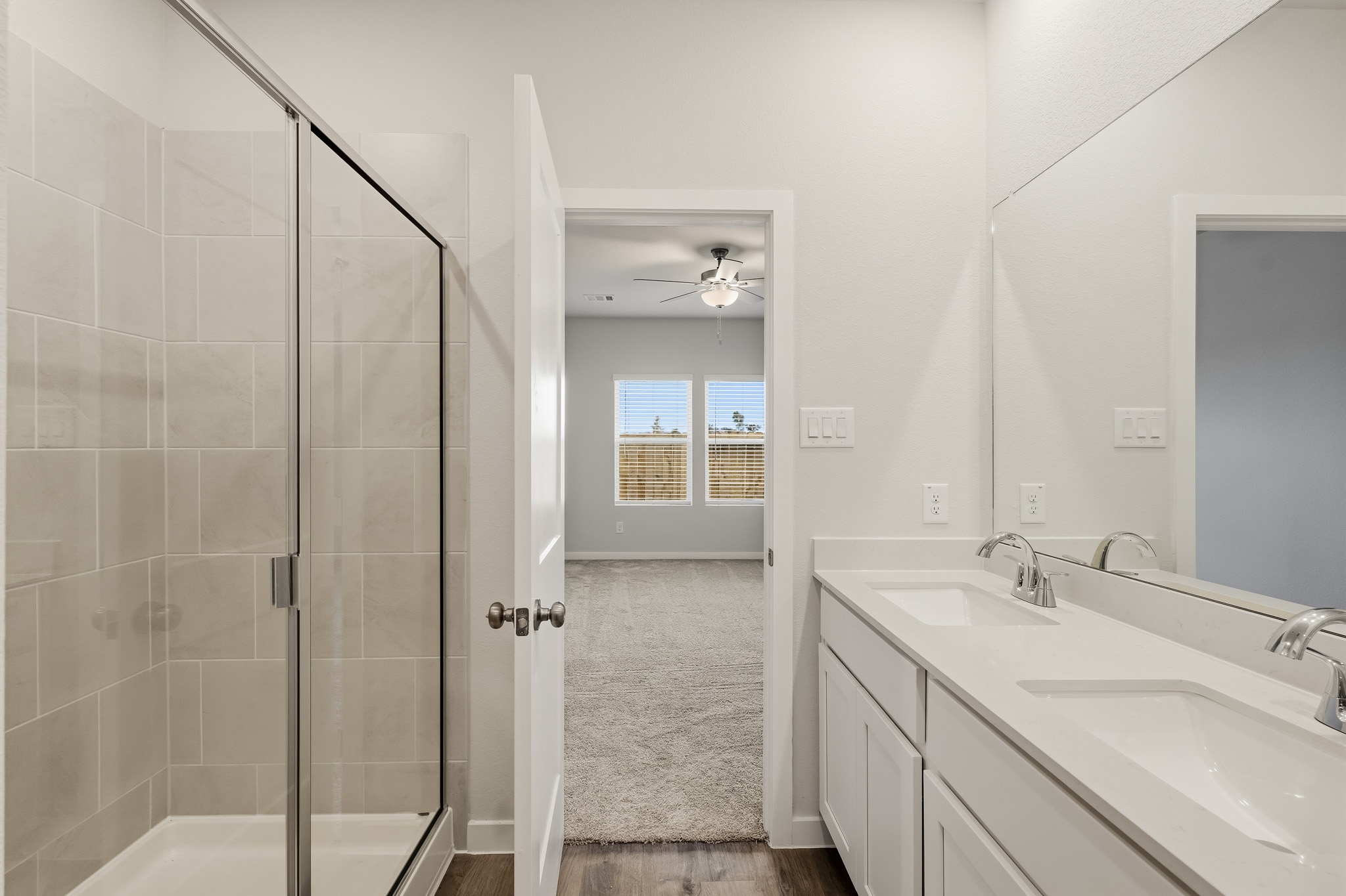 A bathroom with a glass shower.