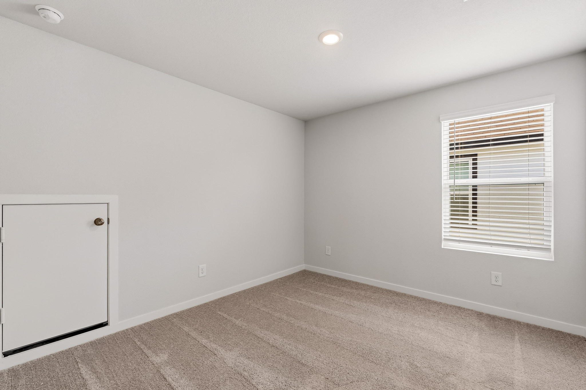 A room with a door and a window.