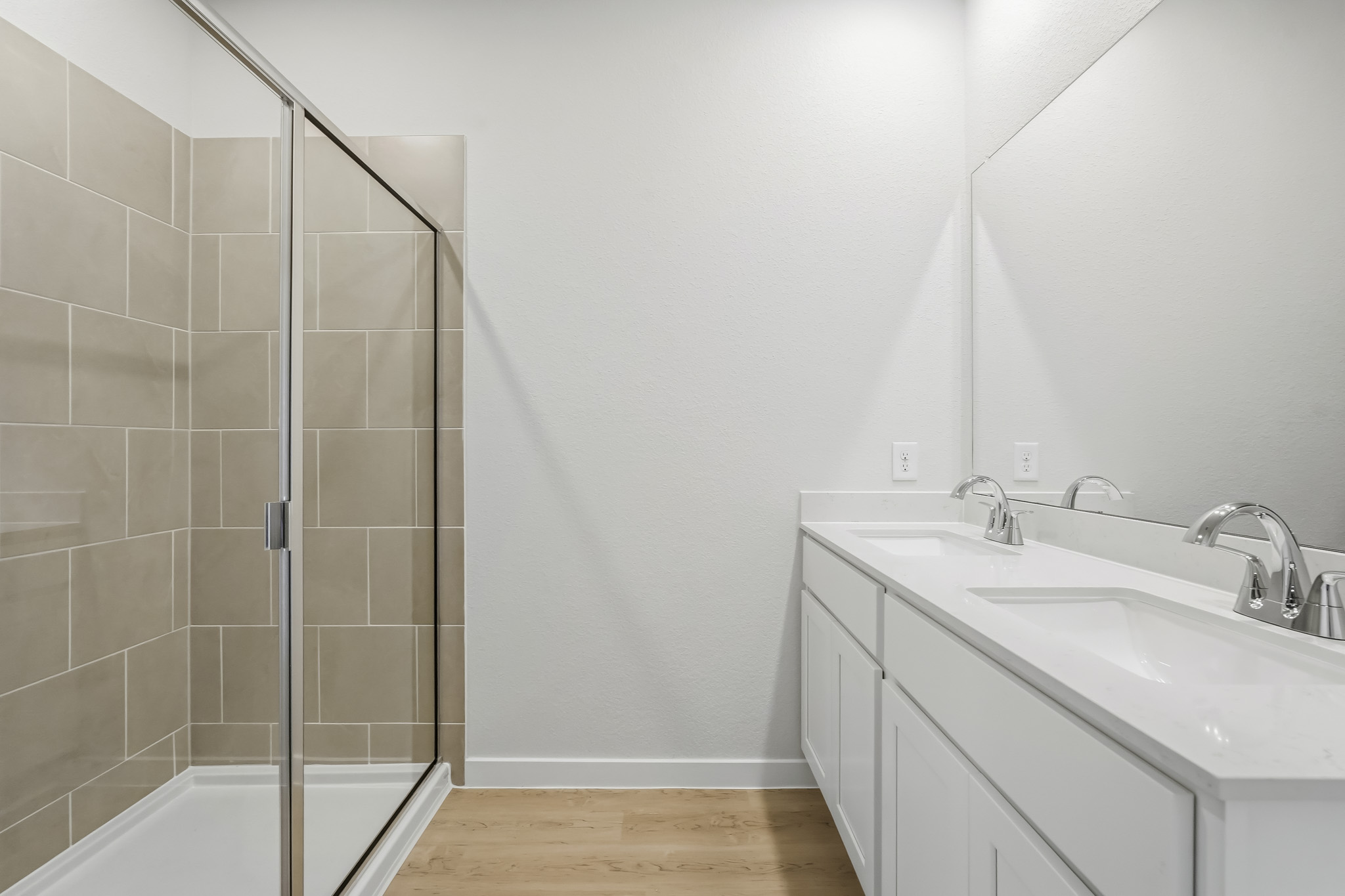 A bathroom with a glass shower.