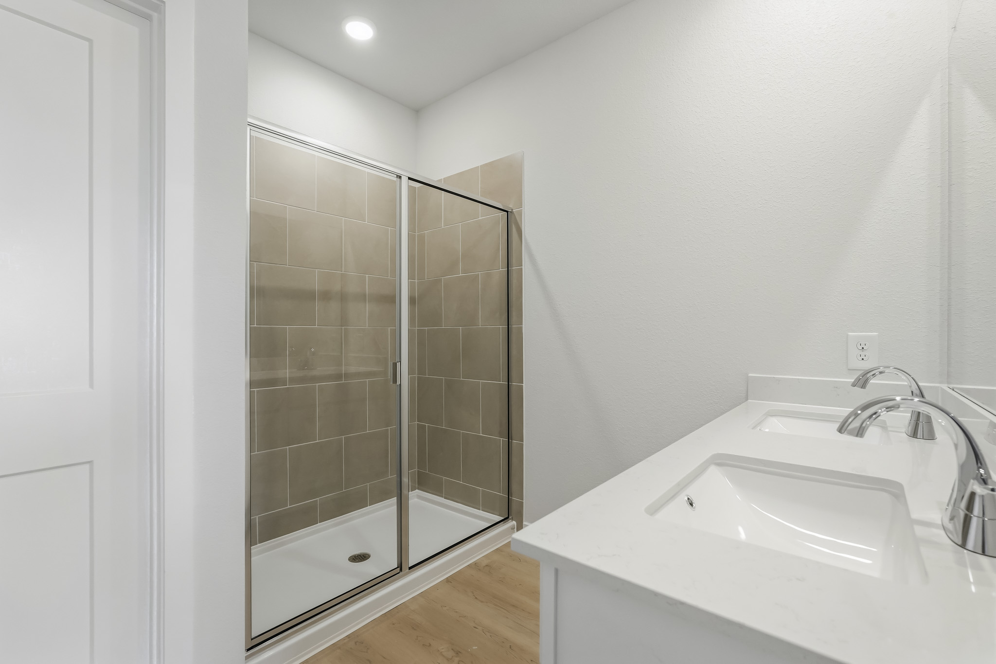 A bathroom with a glass shower.