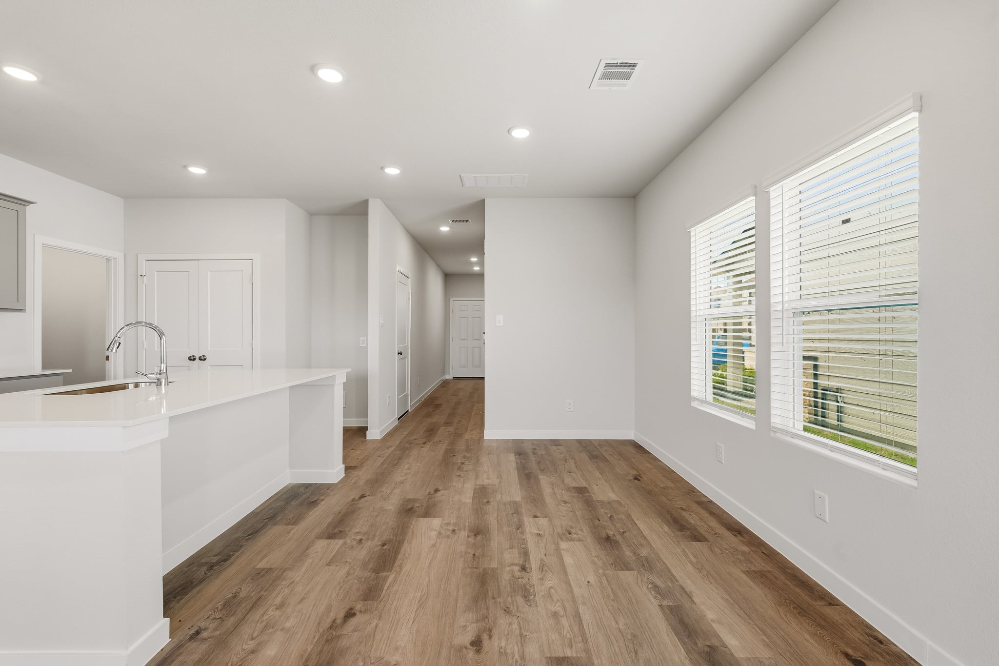 A bathroom with white walls.