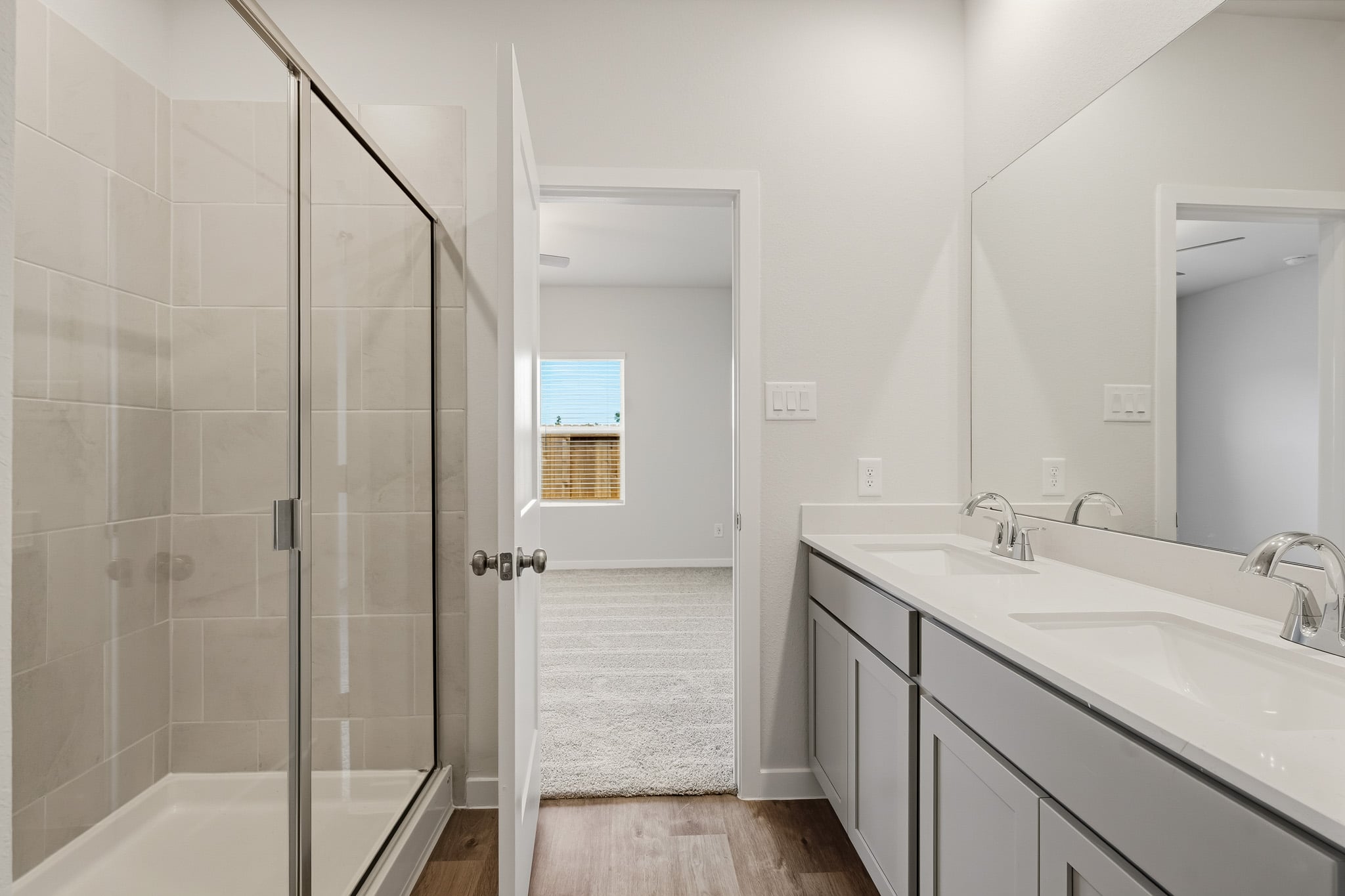 A bathroom with a glass shower.
