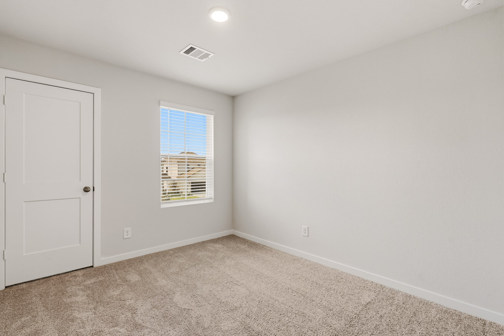 A room with a door and a window.