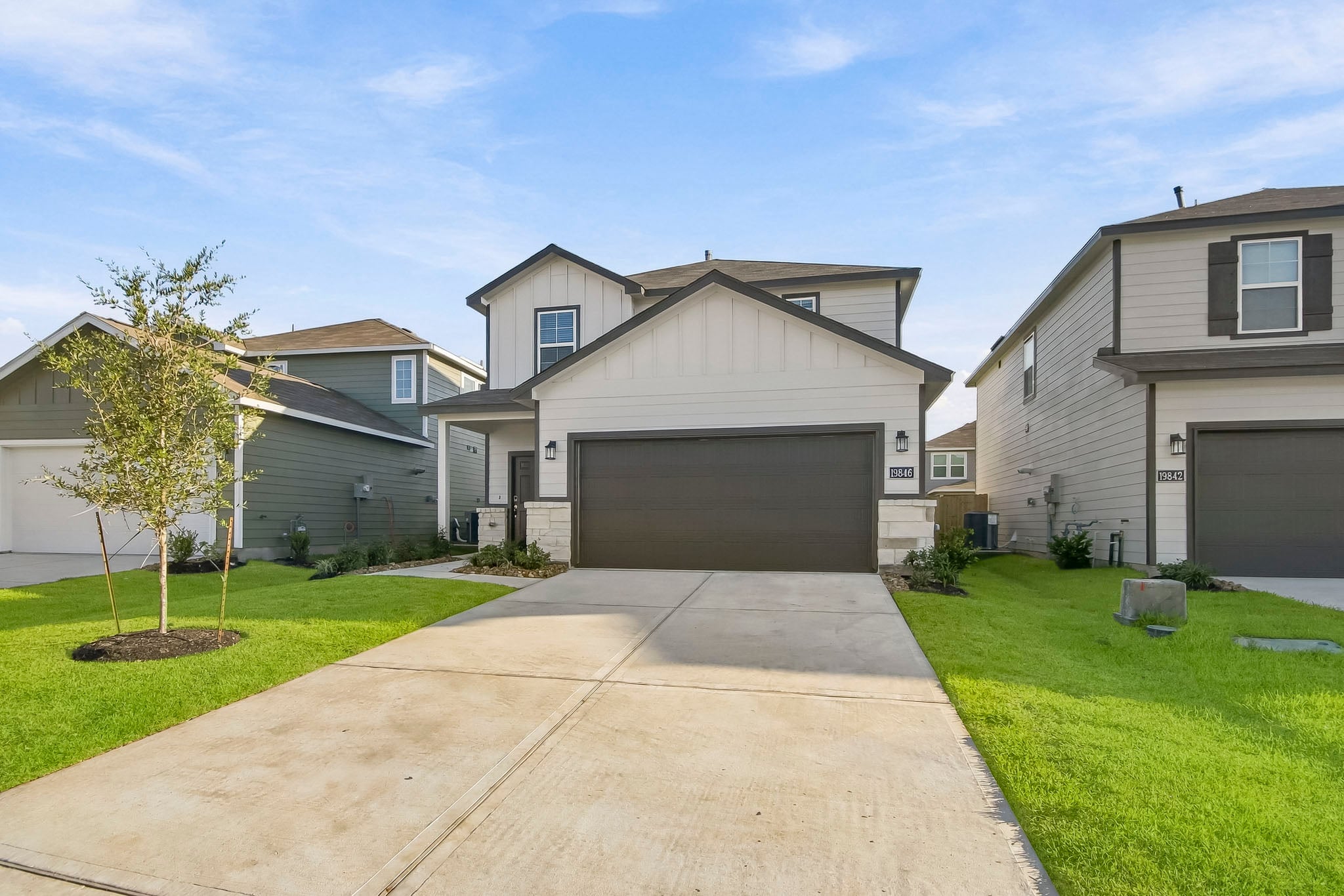 A driveway leading to a house.