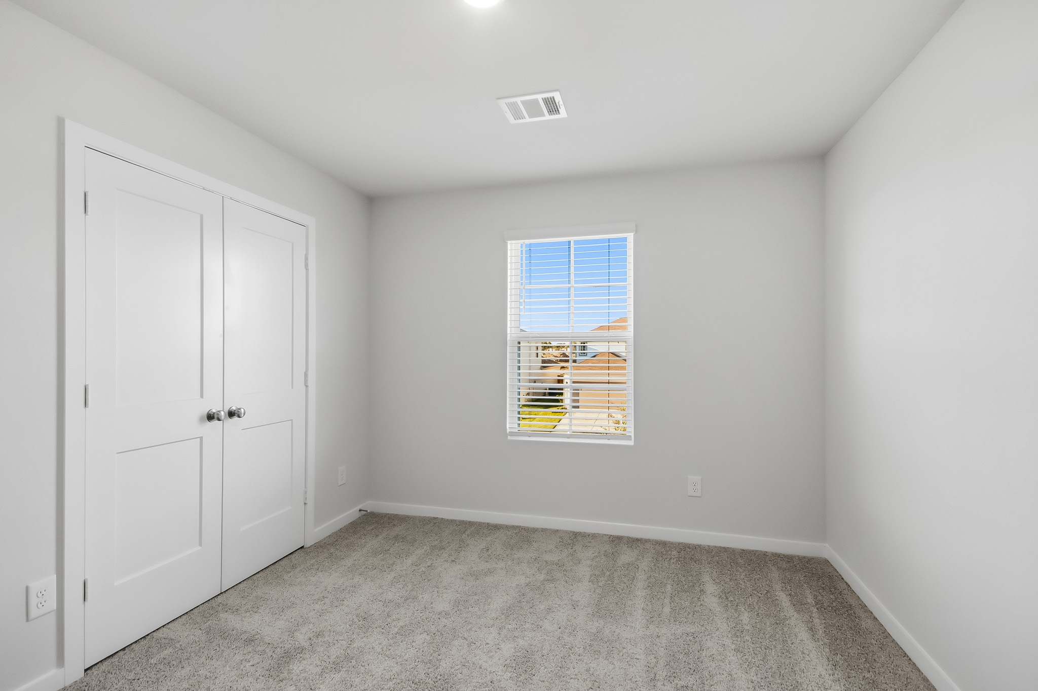 A room with white doors.