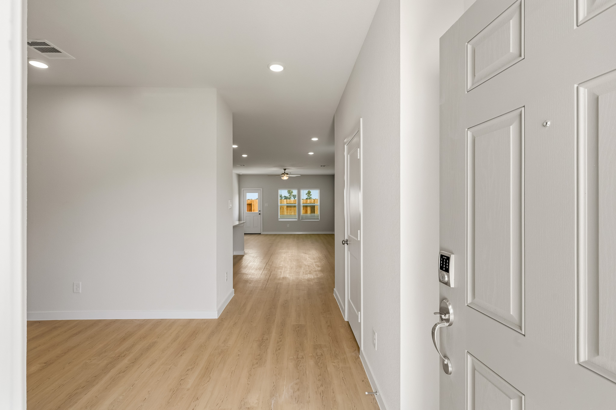 A hallway with white walls.
