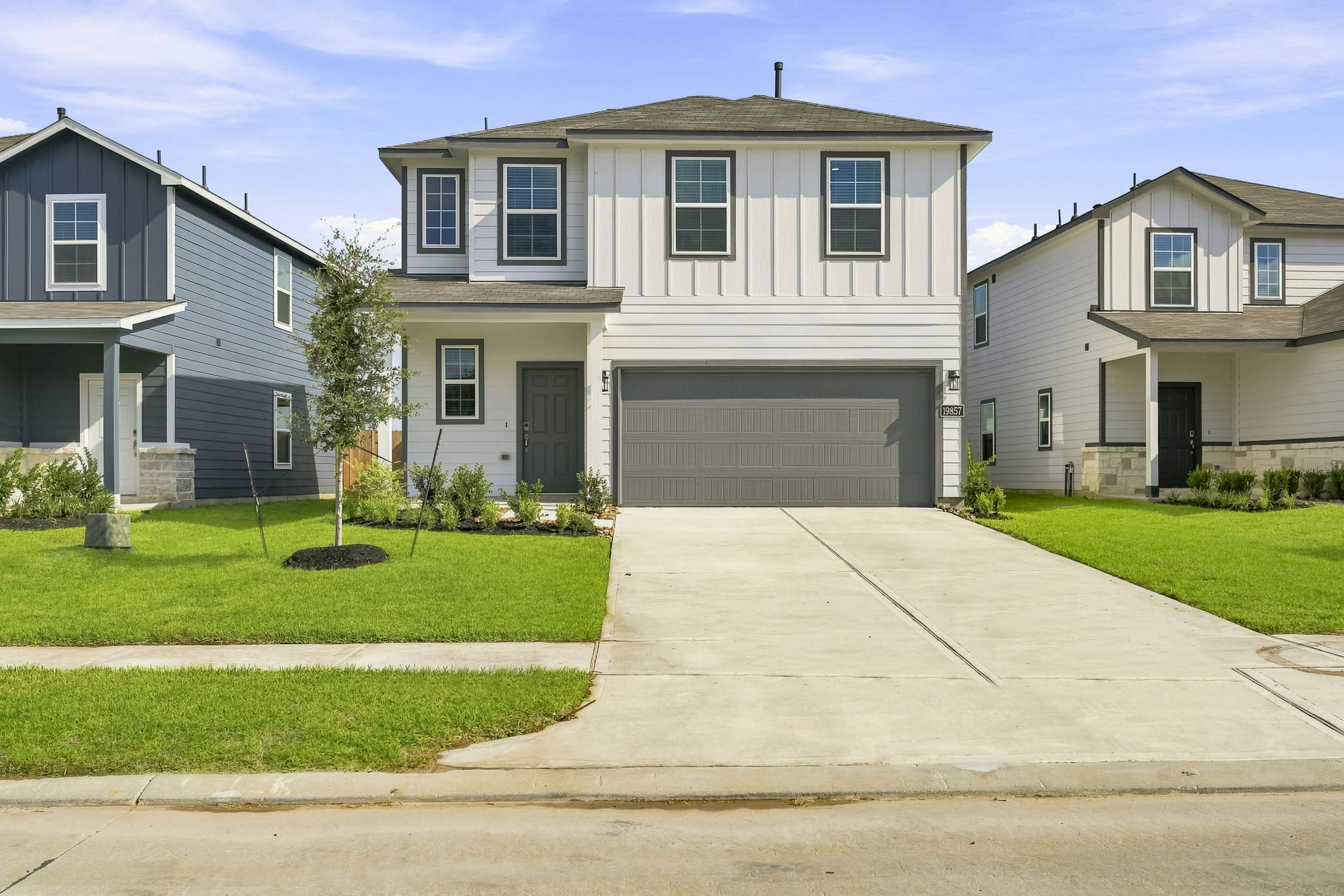 A driveway leading to a house.