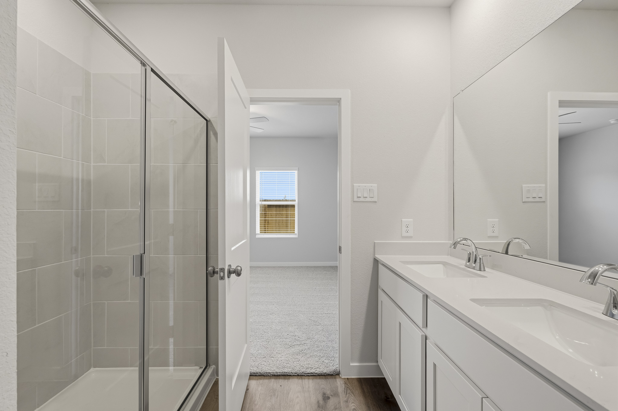 A bathroom with a glass shower.
