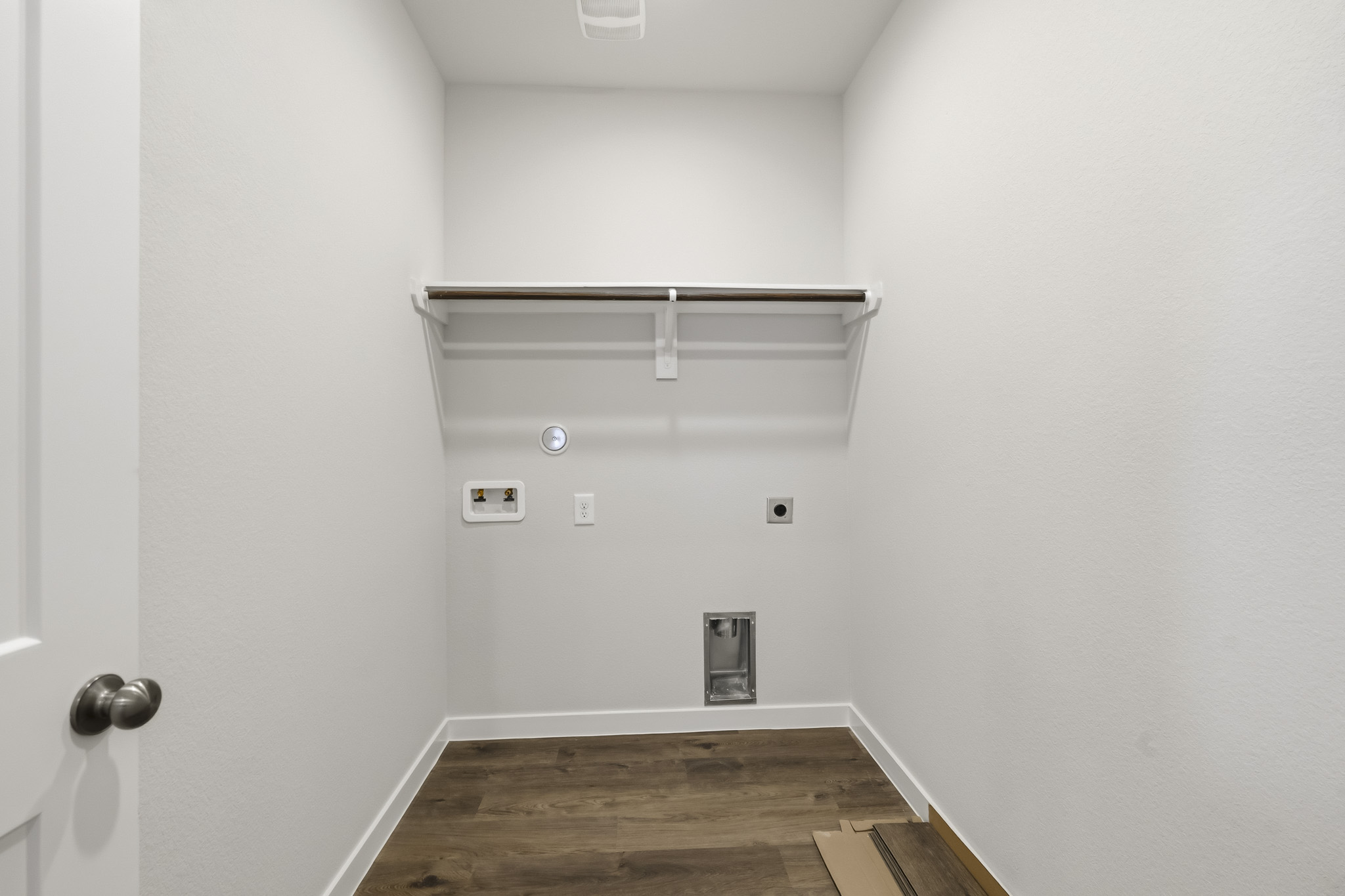 A room with a wood floor and a wood floor.