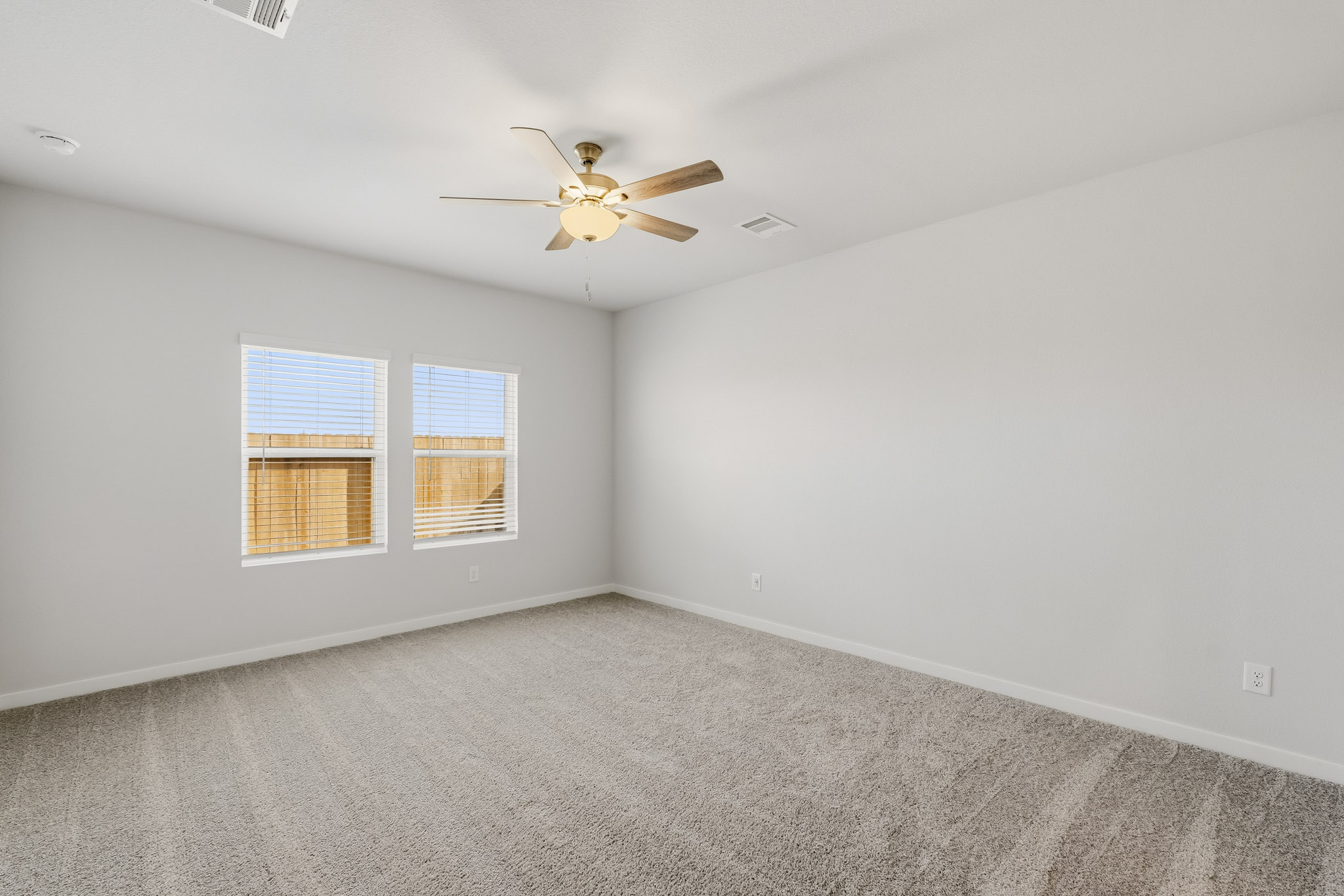 A ceiling fan in a room.
