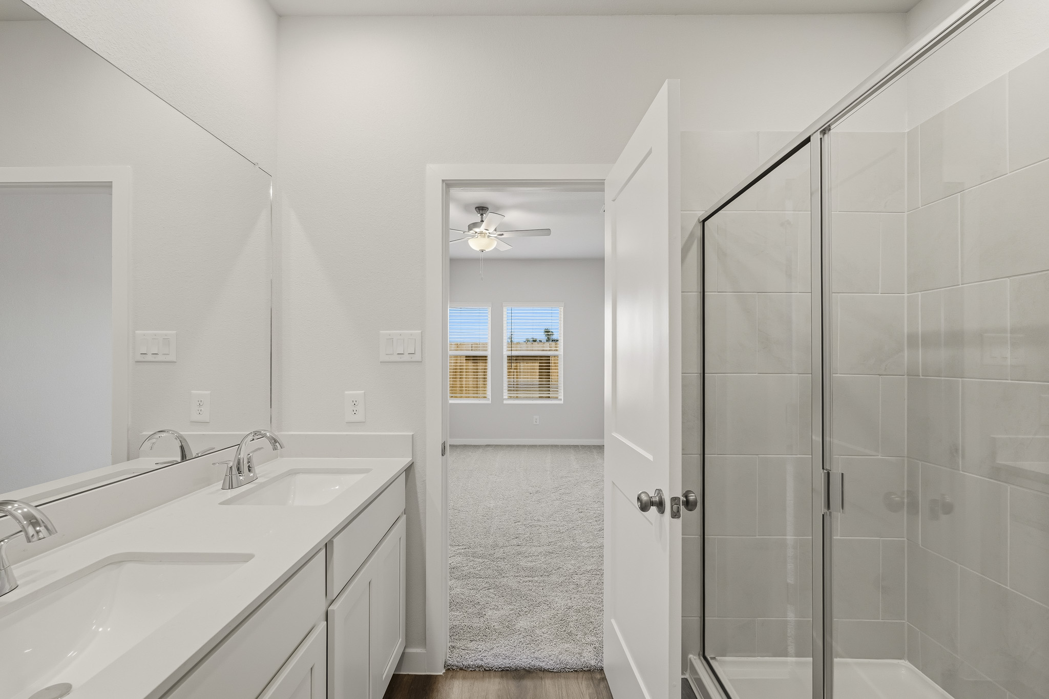 A bathroom with a glass shower.