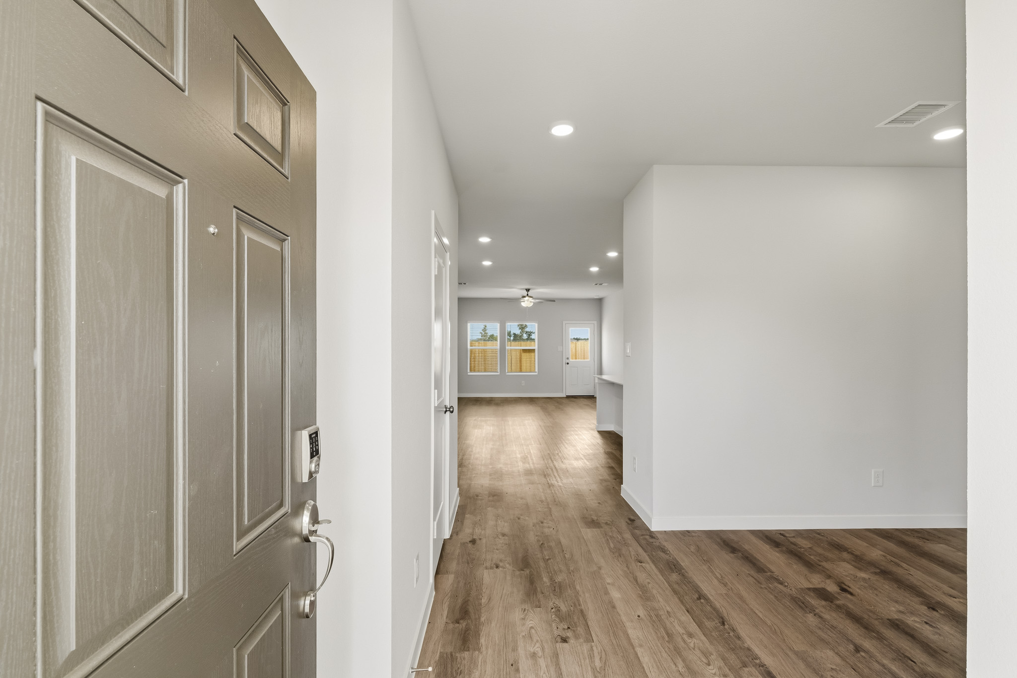 A hallway with white walls.