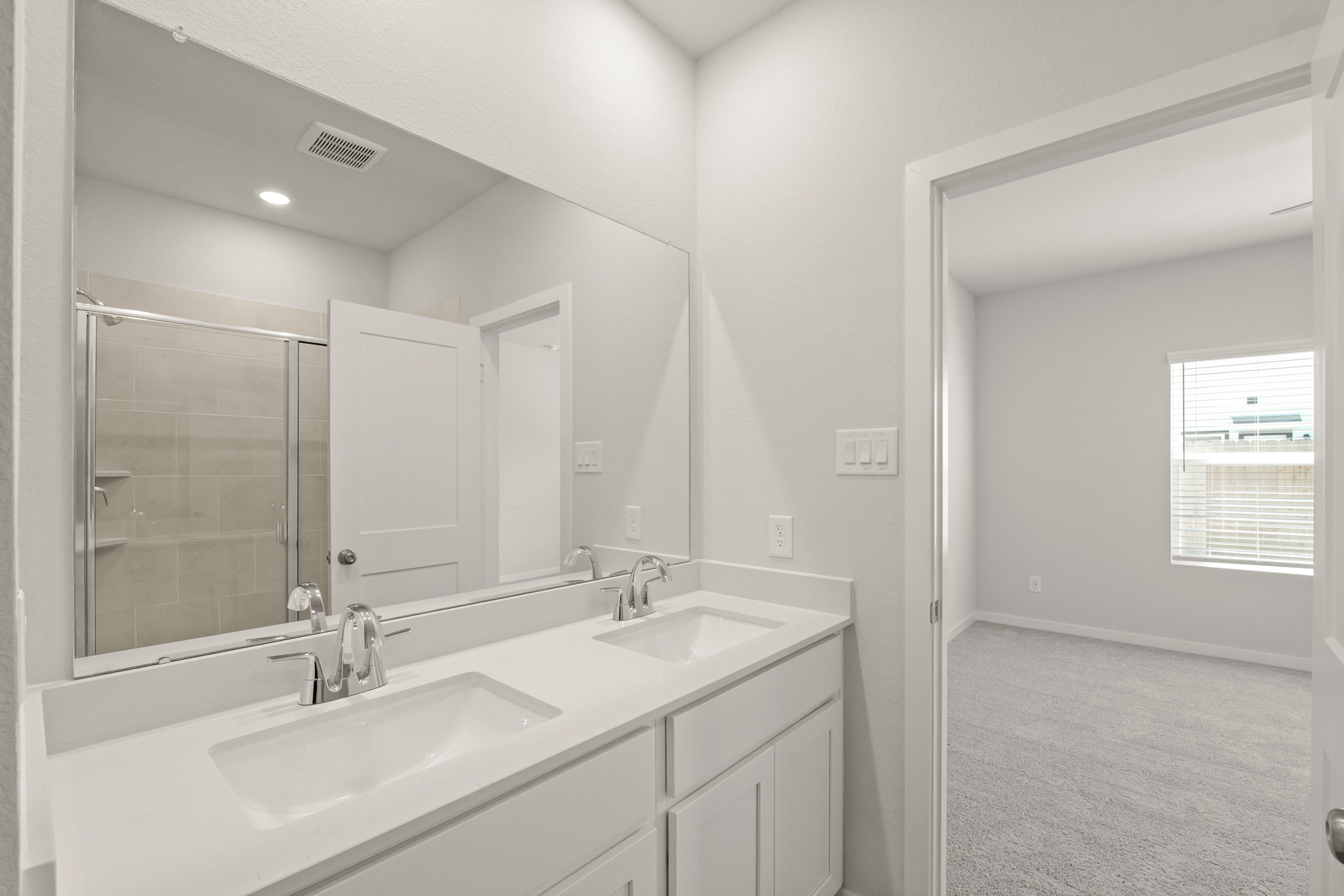 A bathroom with two sinks.