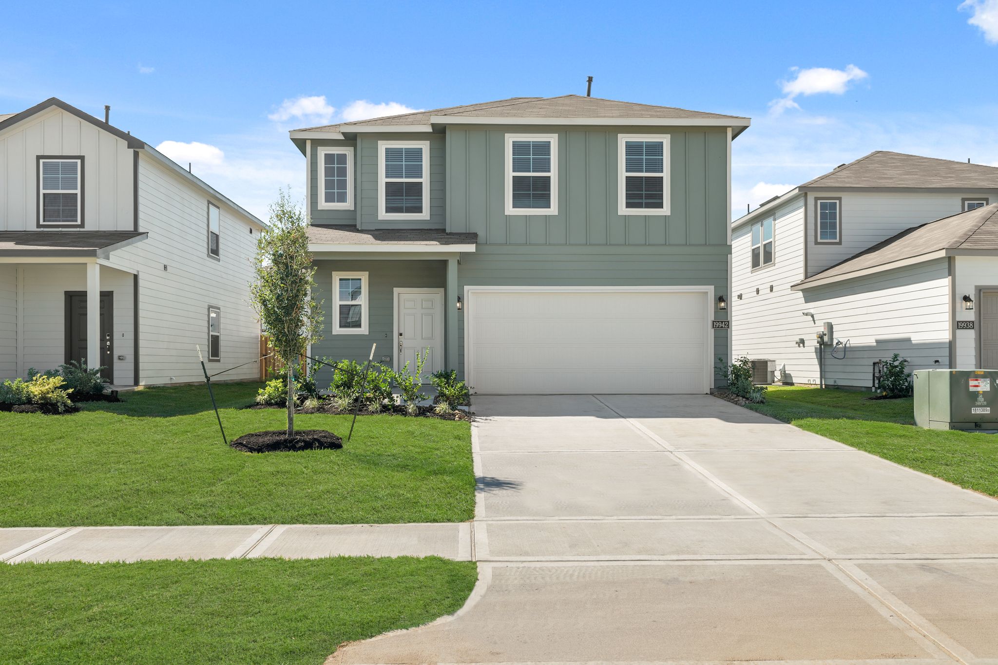 A driveway leading to a house.