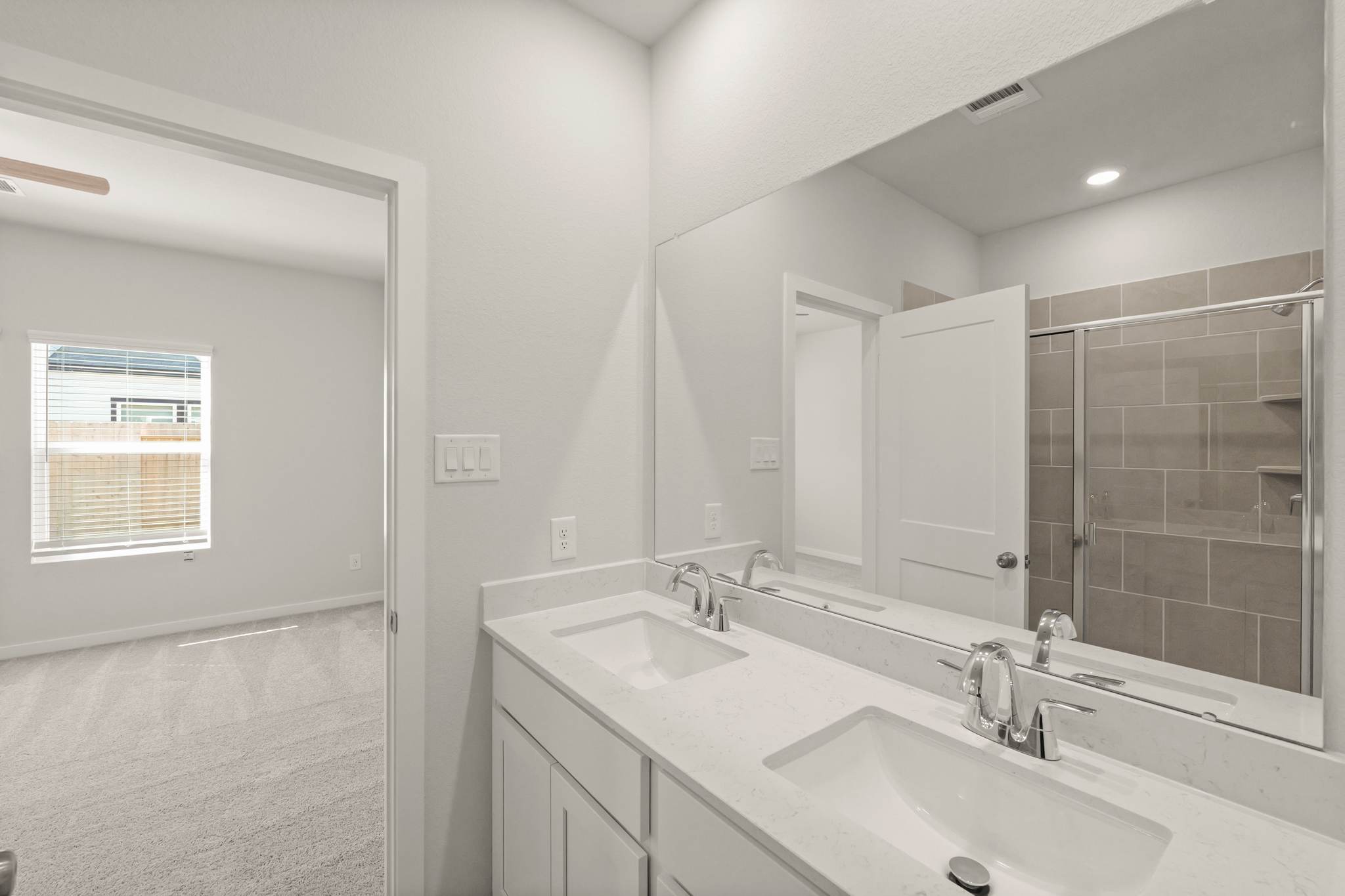 A bathroom with two sinks.