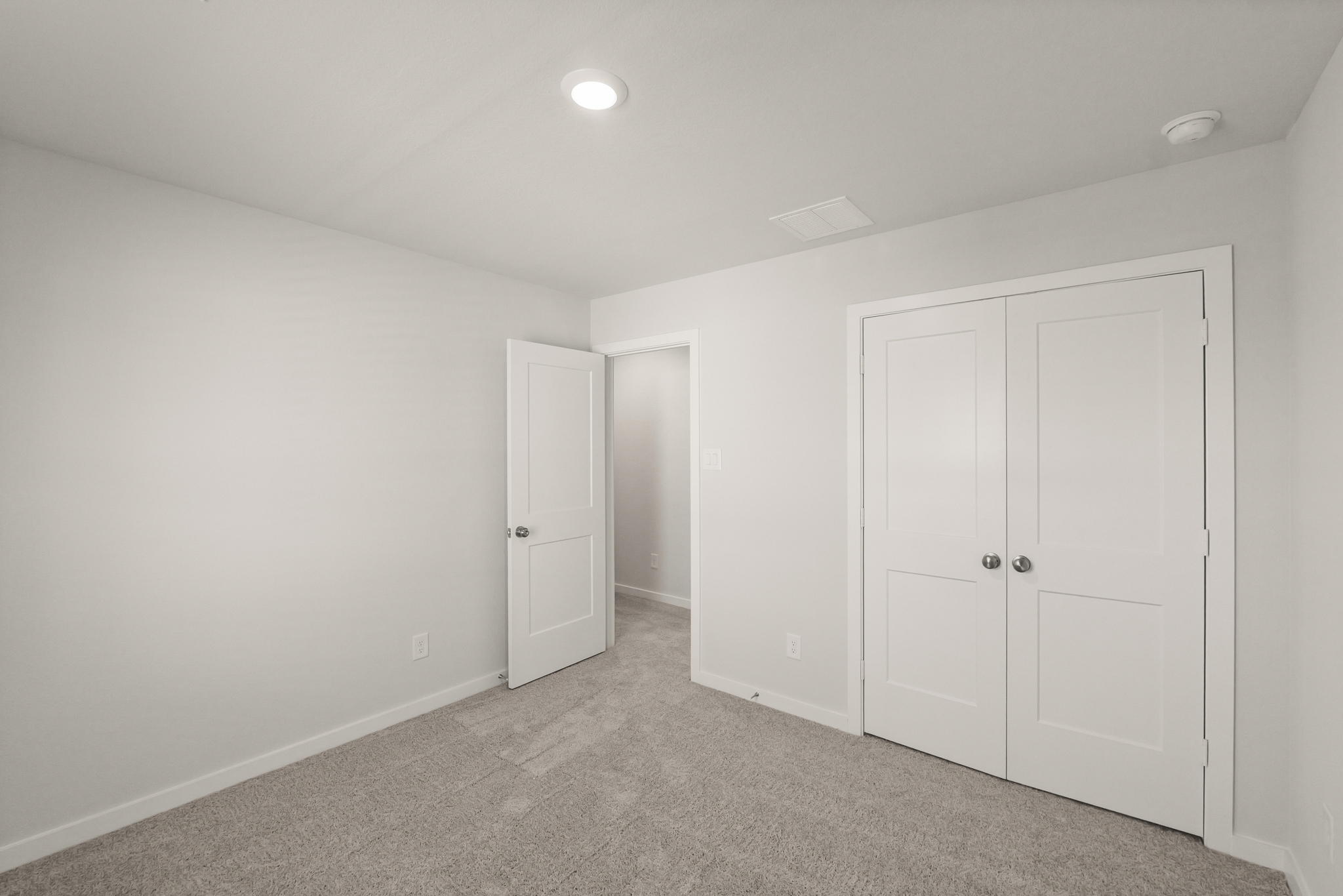 A room with white doors.