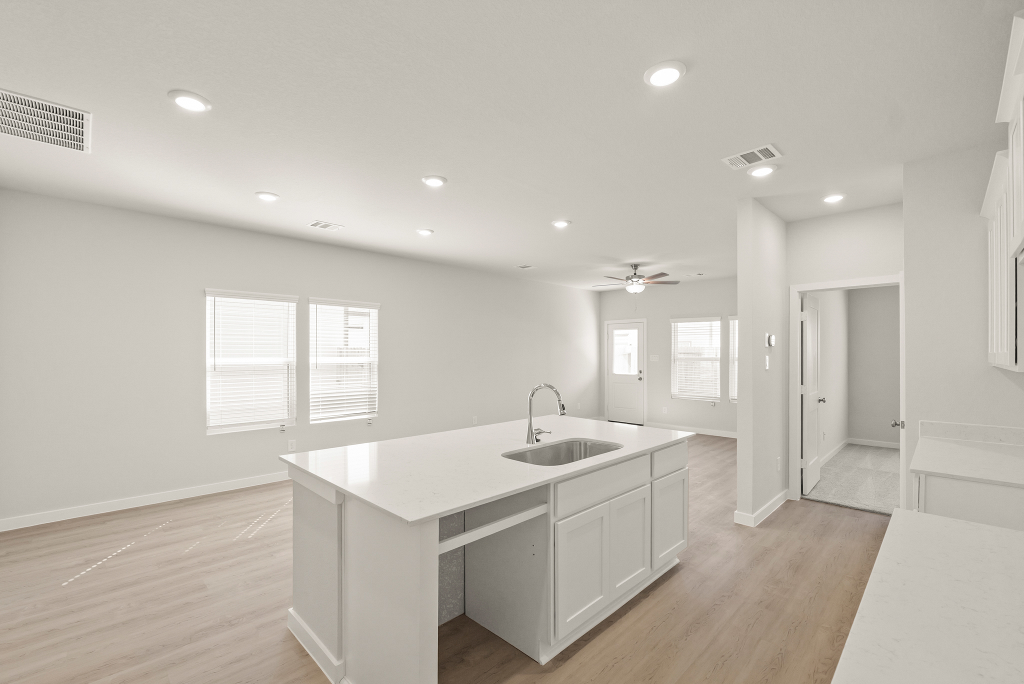 A kitchen with a sink and cabinets.