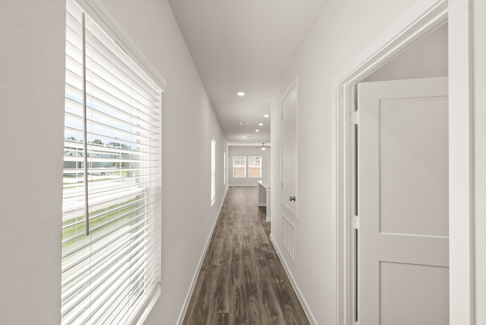 A hallway with white doors.