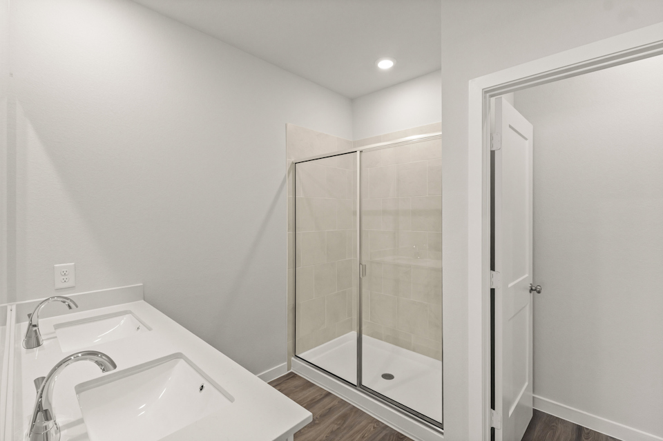 A bathroom with a glass shower.